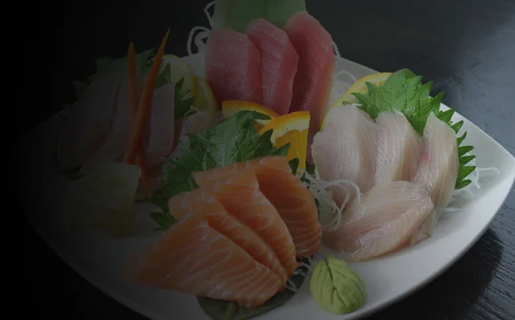 Assorted Japanese sashimi platter with fresh fish and garnishes