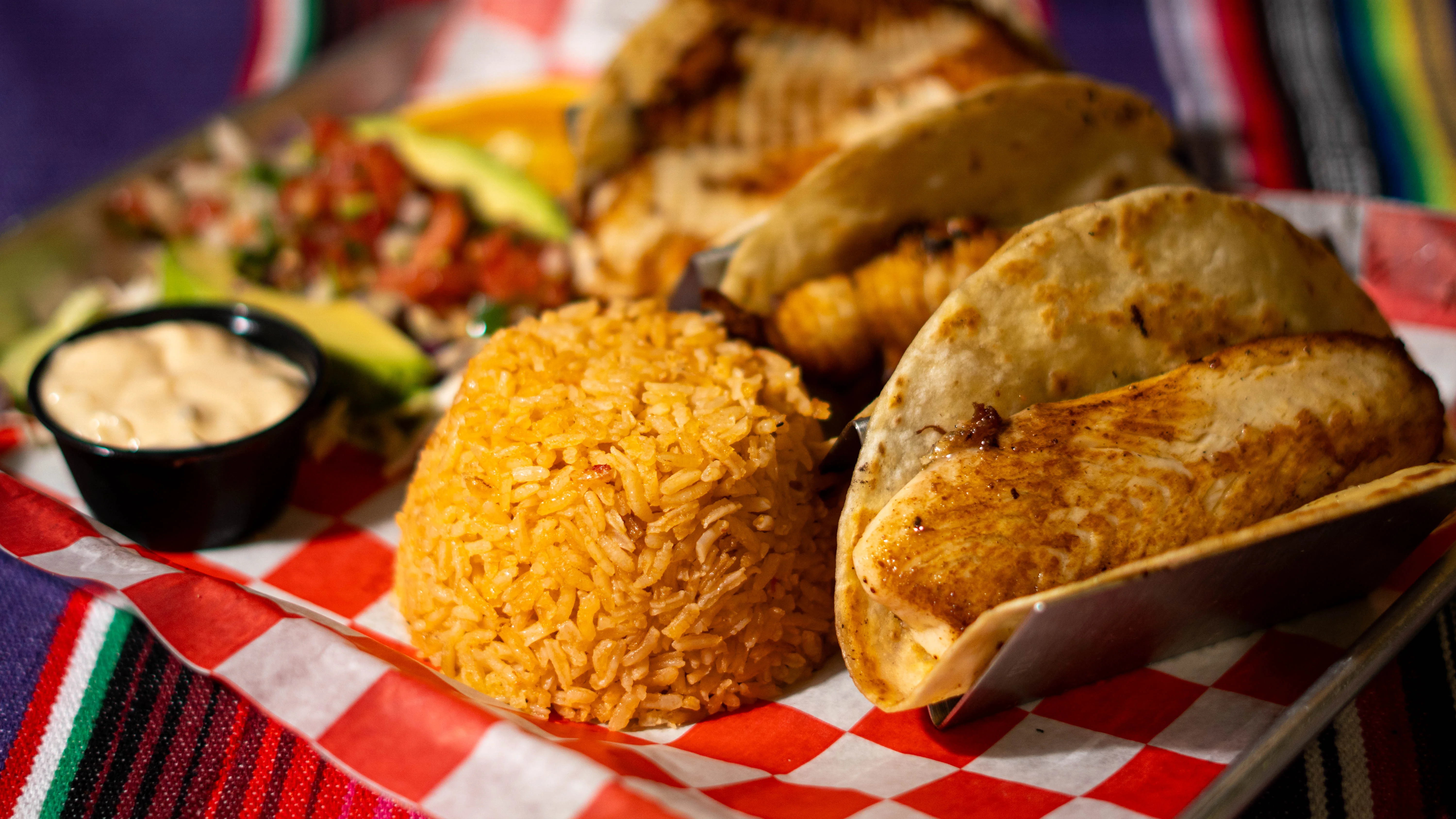 Delicious Mexican fish tacos with rice and fresh salsa