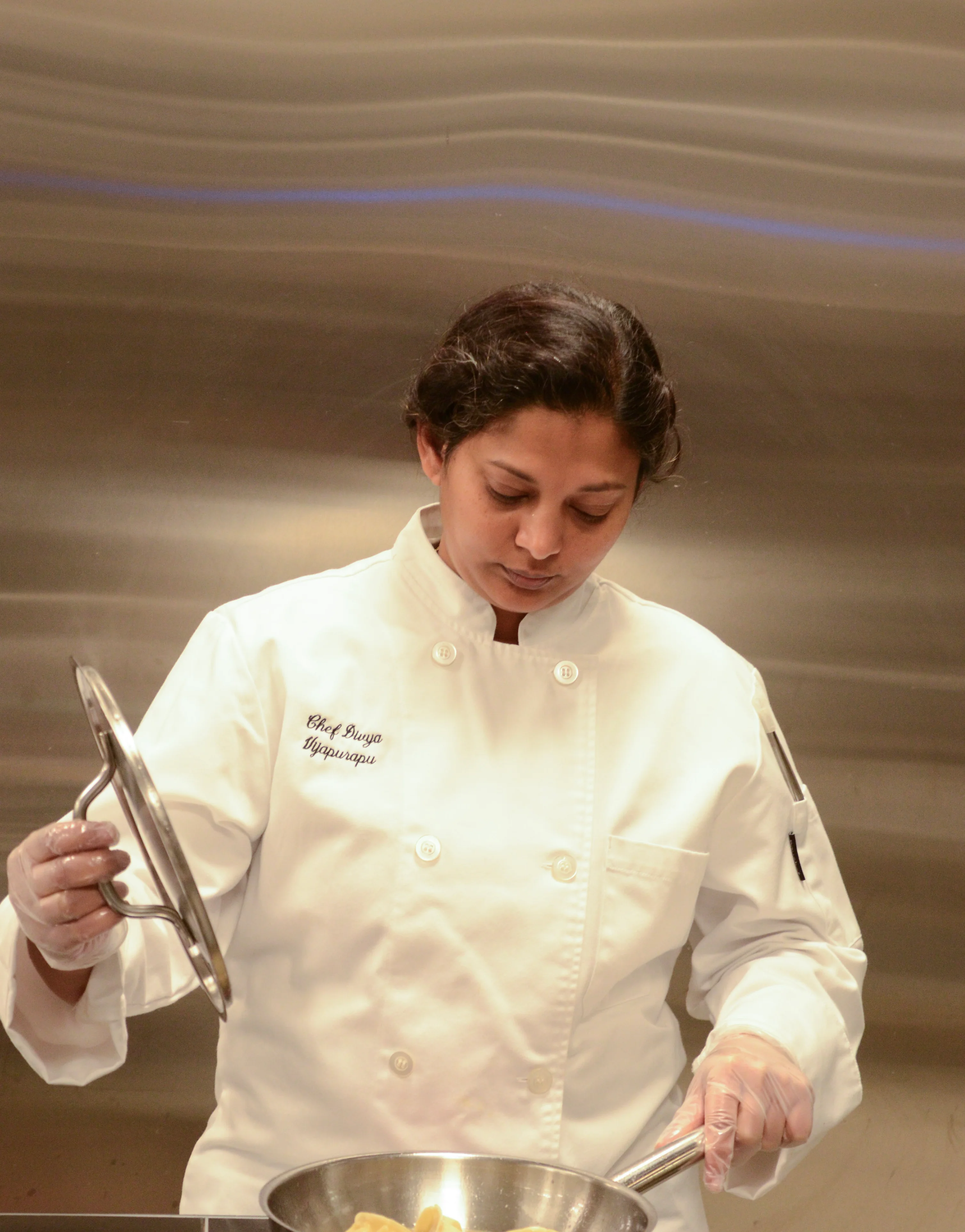 A restaurant chef preparing a dish