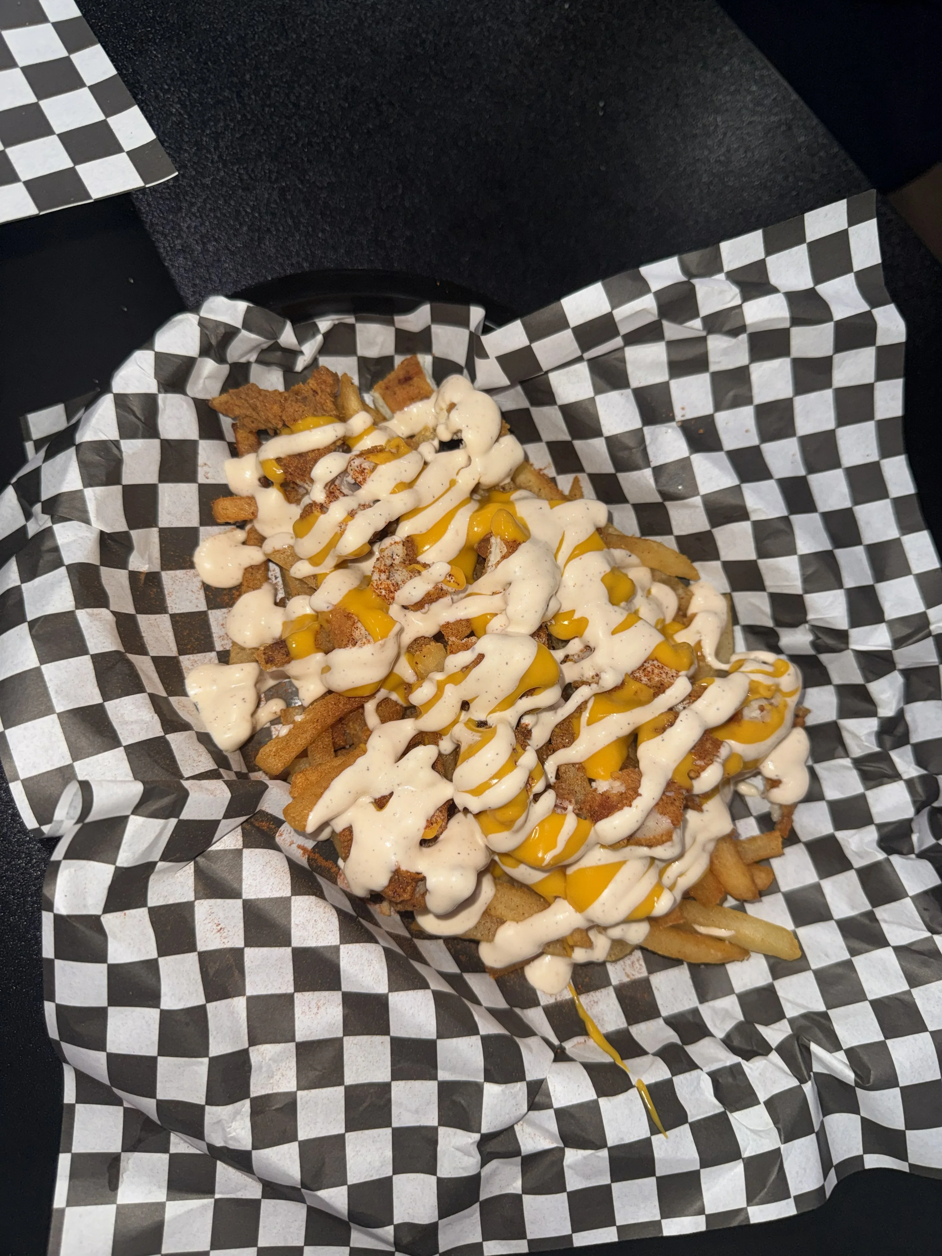 Loaded fries with crispy chicken and creamy cheese sauce