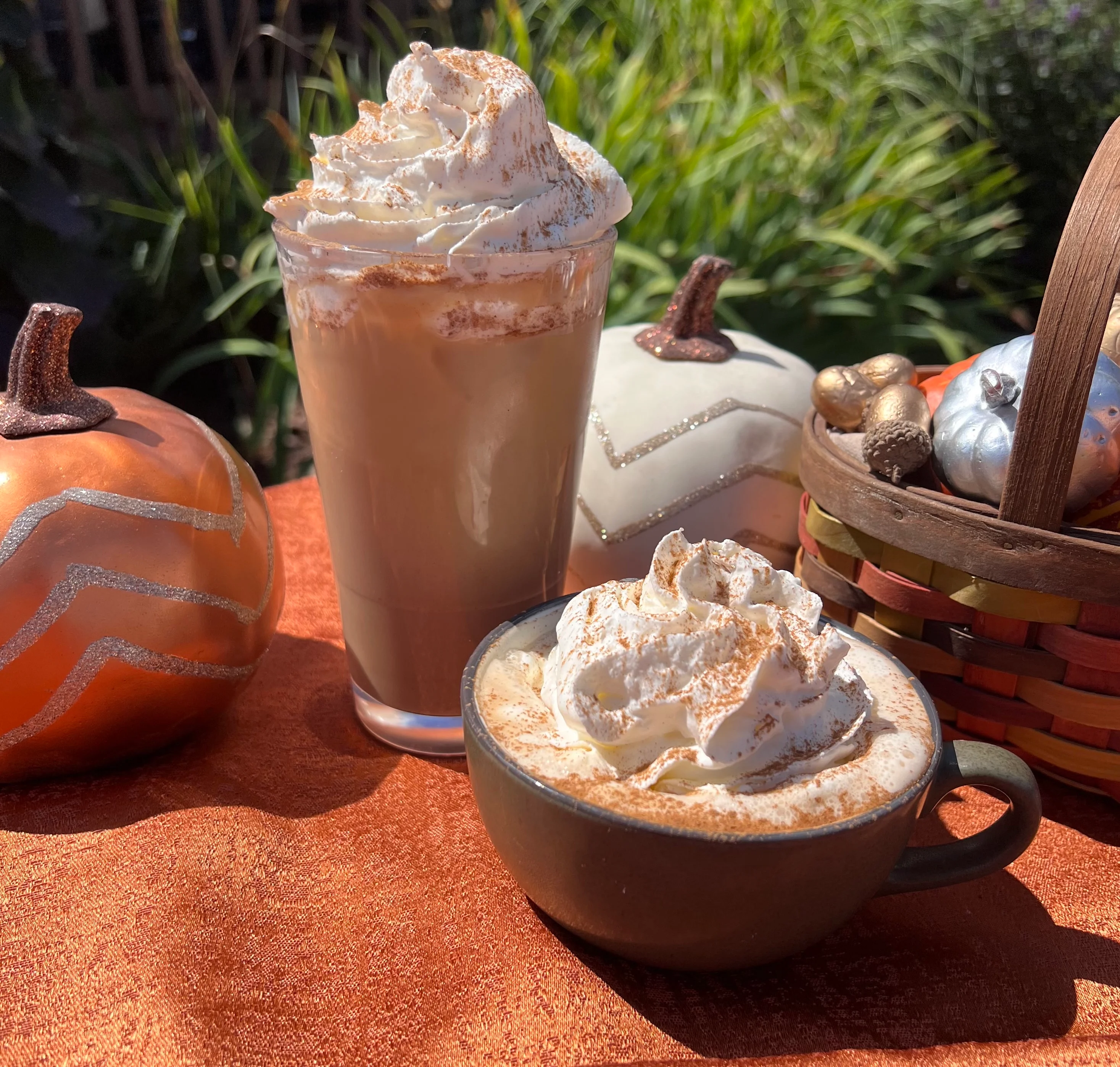 Iced coffee drink topped with whipped cream