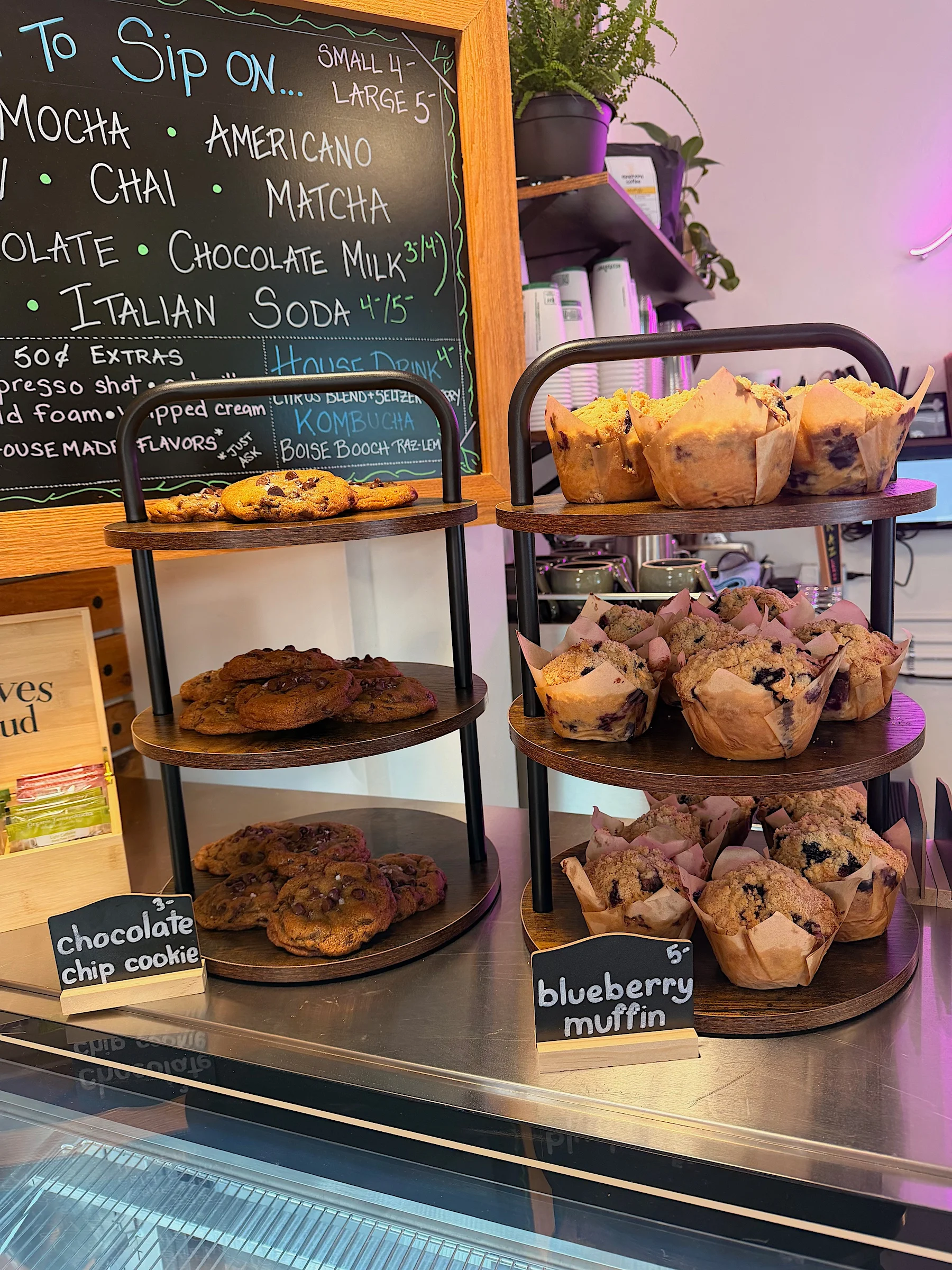 Freshly baked blueberry muffins and chocolate chip cookies on display