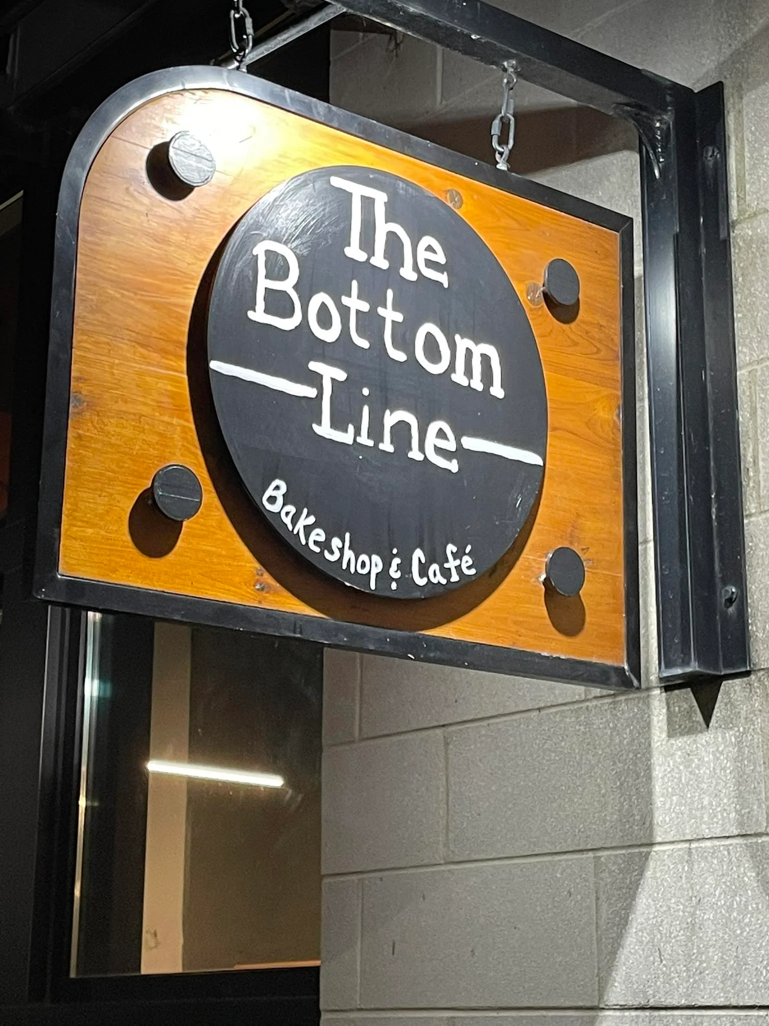 Sign for The Bottom Line Bakeshop & Café