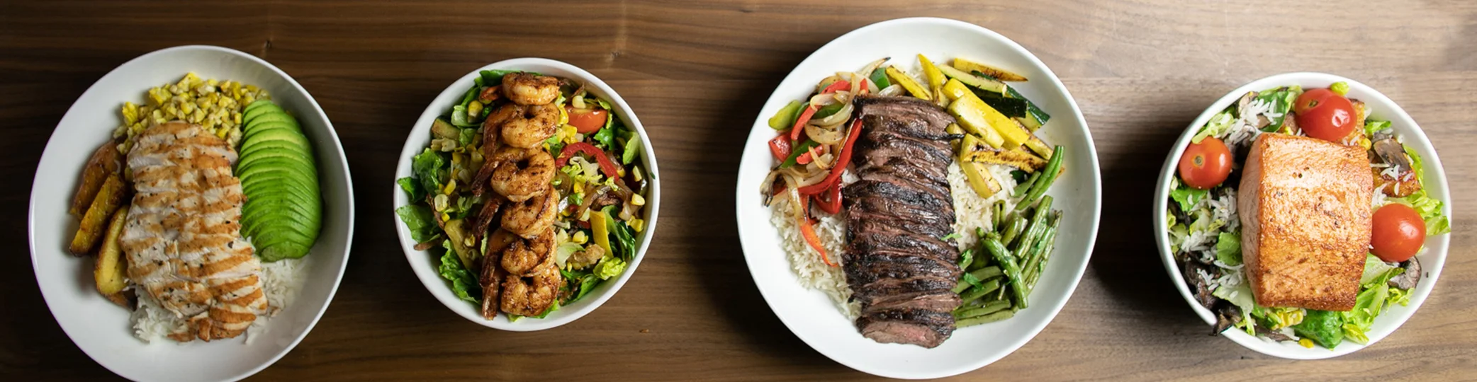 Colorful Latin American feast featuring grilled meats and fresh vegetables