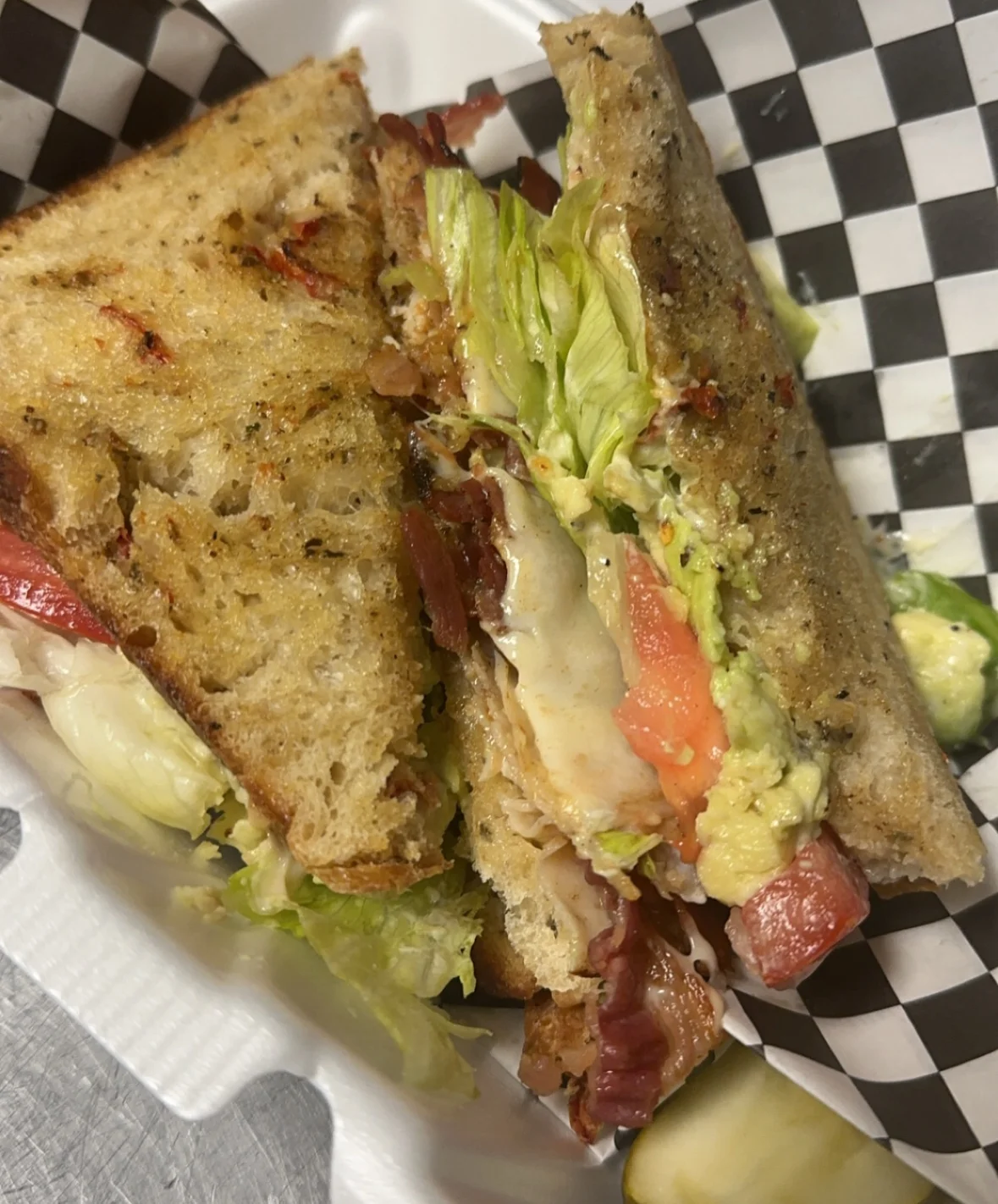 Classic club sandwich with layers of meat and fresh vegetables