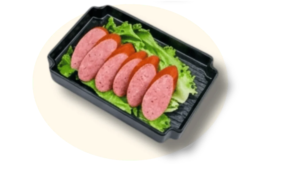 Sliced meat on a bed of lettuce in a black serving tray.