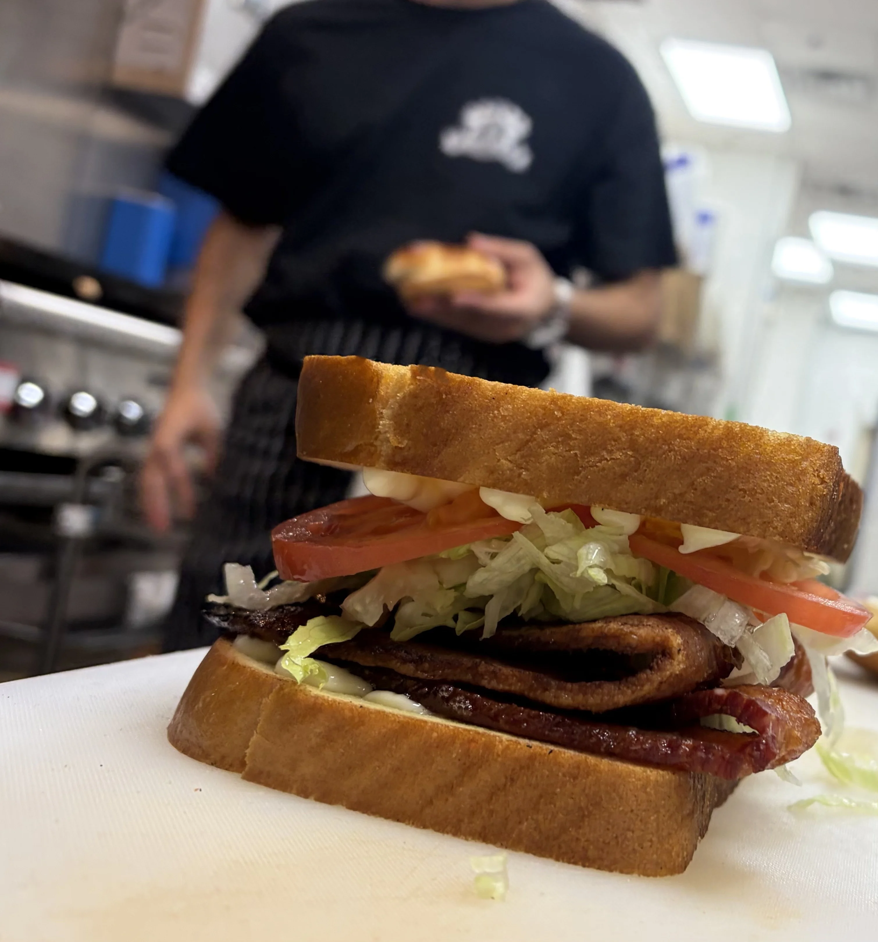 Double cheeseburger with lettuce and tomato on a toasted bun