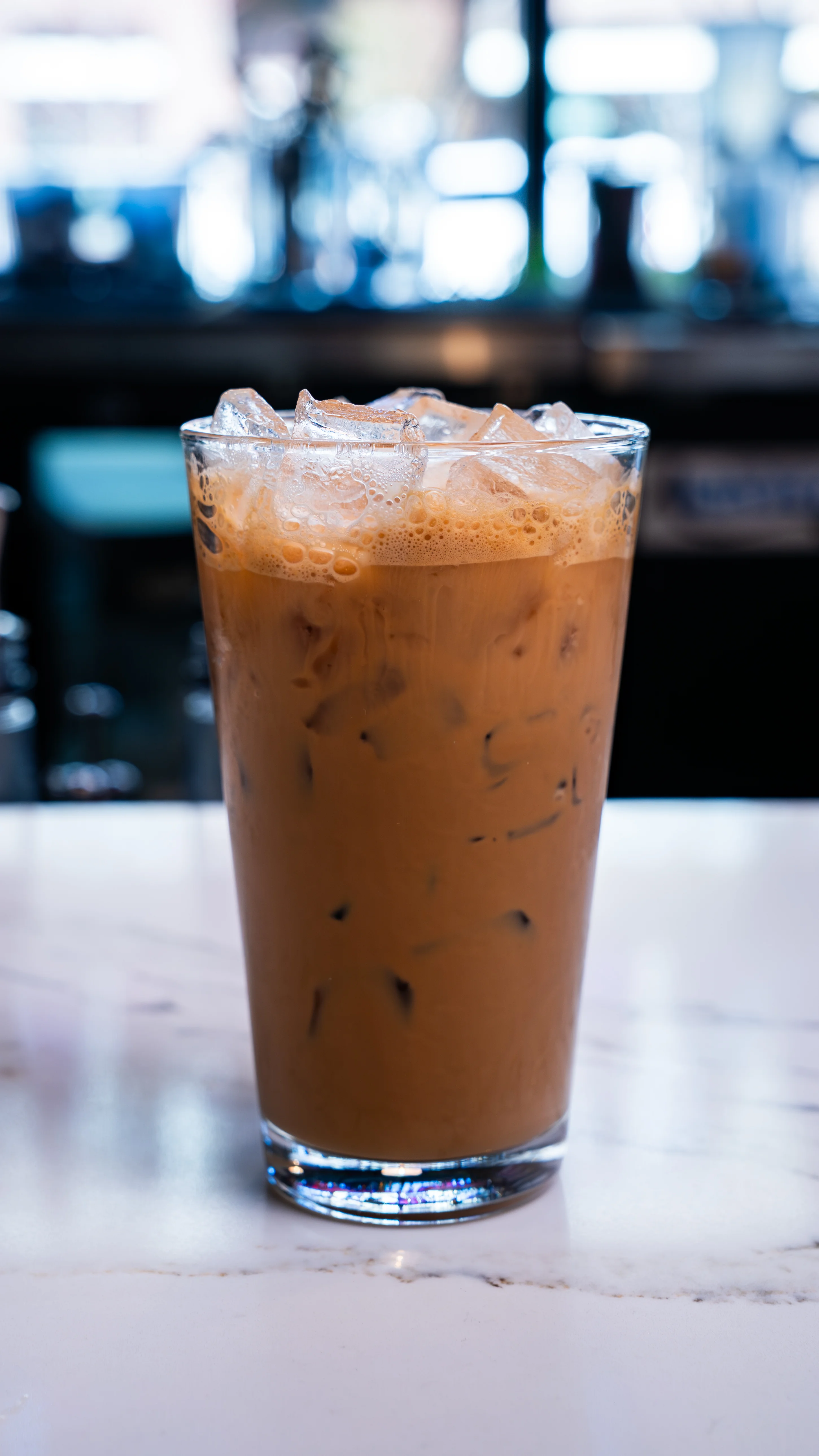 A vibrant Vietnamese coffee mocktail served in a glass with ice and garnishes.