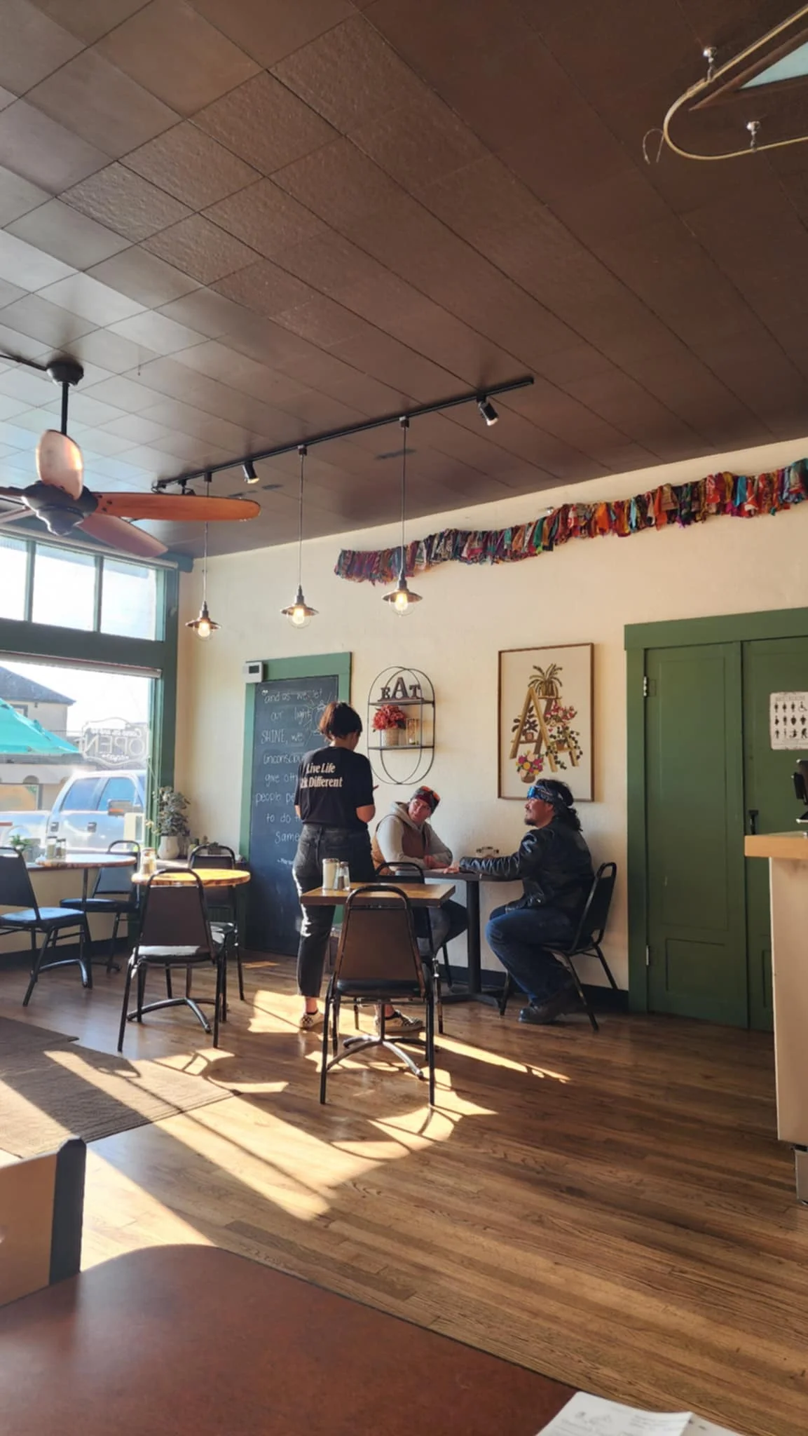 Cozy restaurant interior with natural light and wooden decor