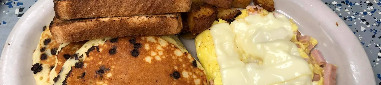 Classic American breakfast with pancakes and omelette