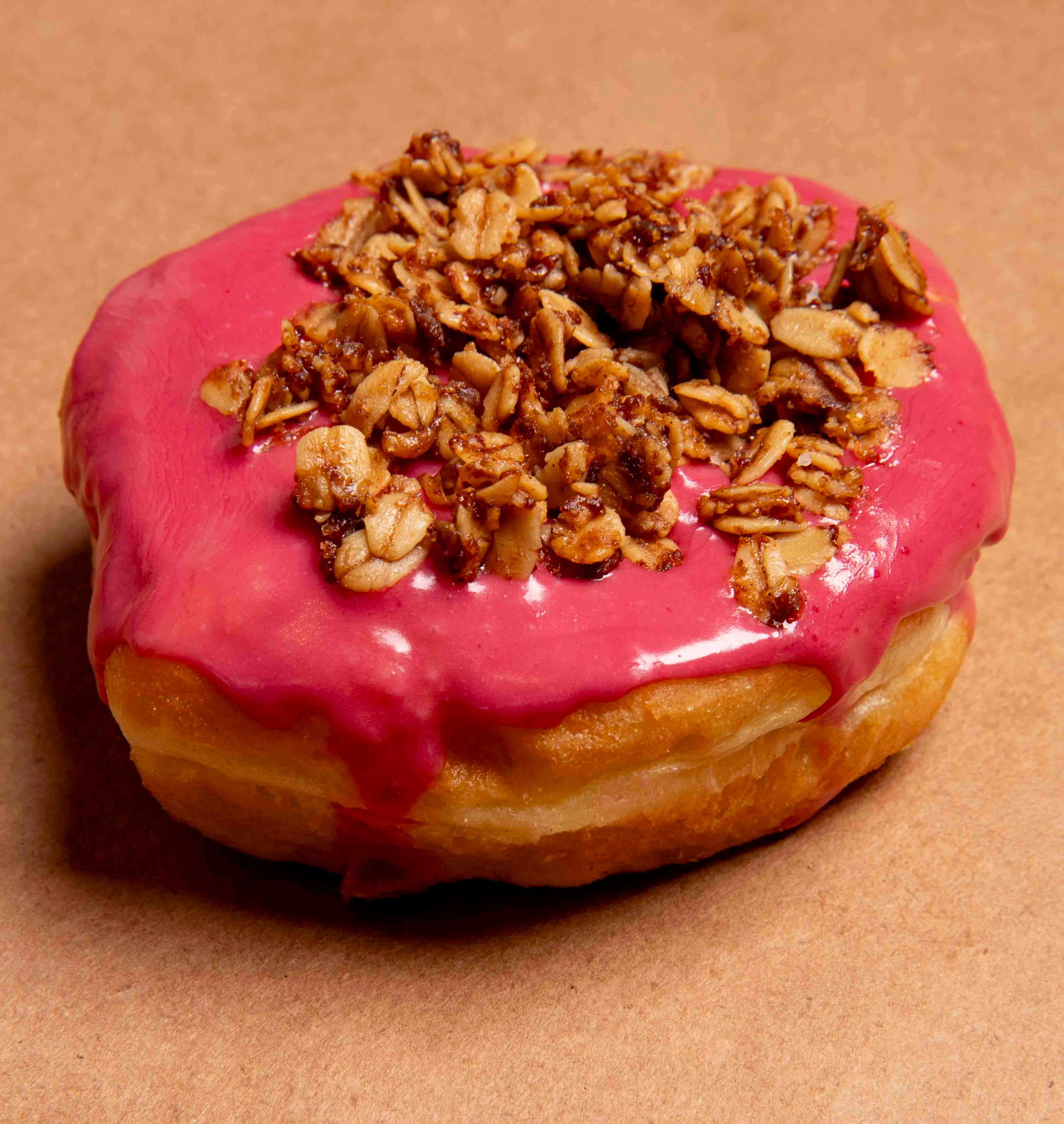 Matcha donut topped with yellow crumble