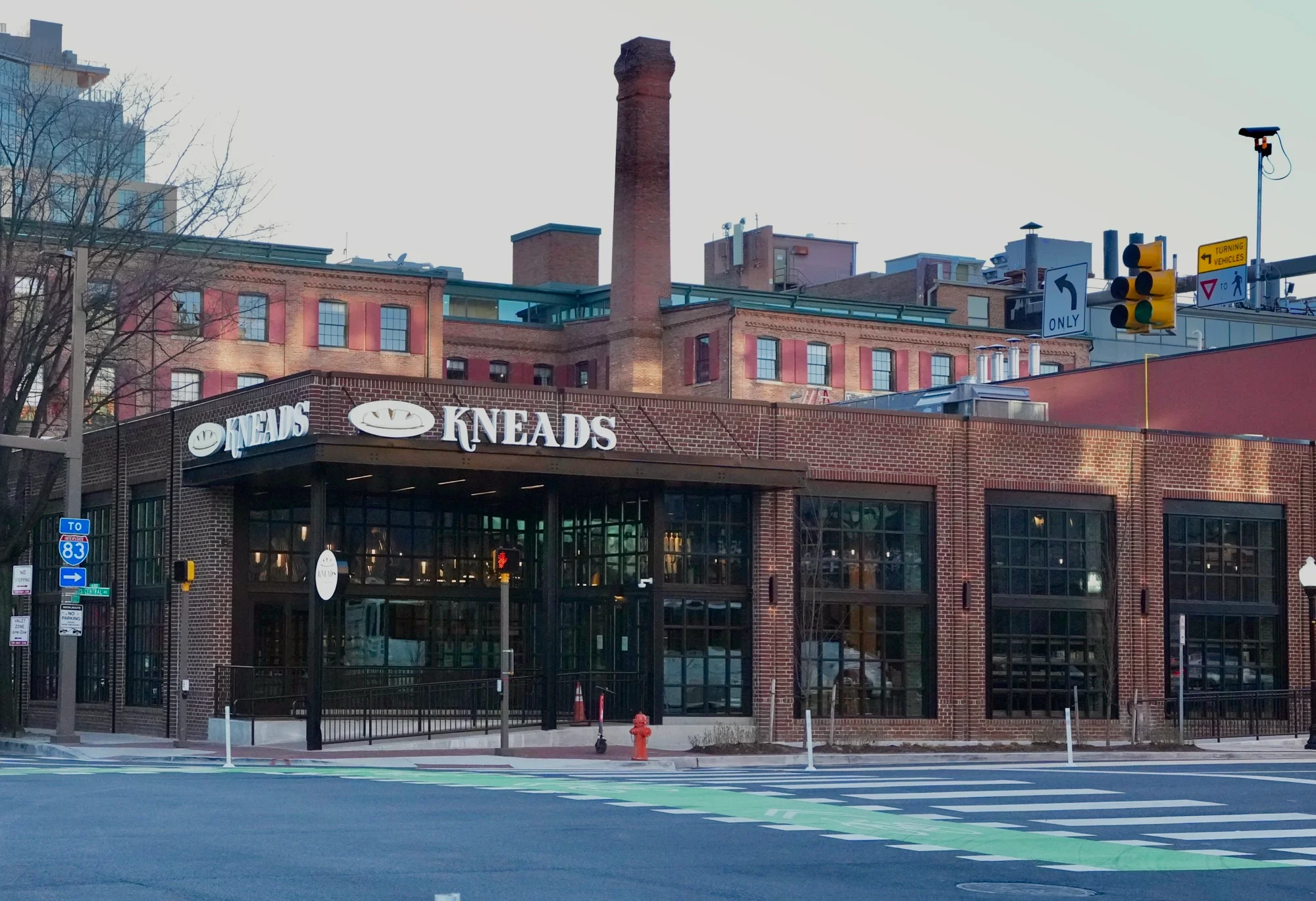 Modern restaurant exterior with brick facade and large windows