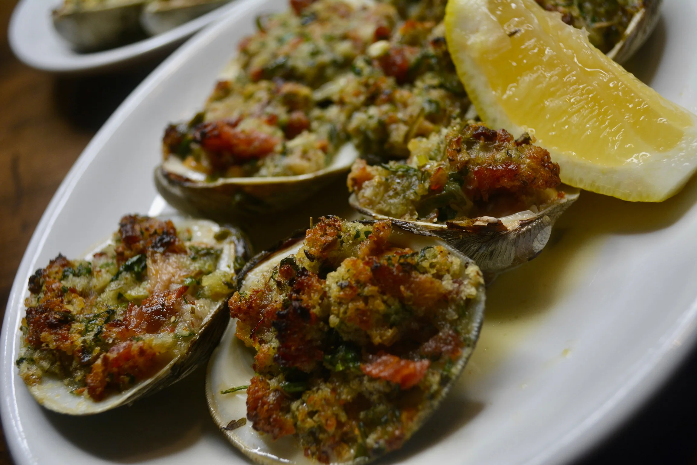 Baked stuffed clams with breadcrumbs and herbs