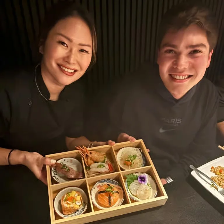 Delicious gourmet burger with fresh toppings on a wooden table