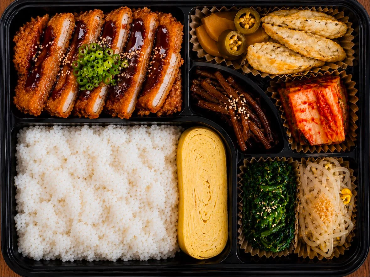 Japanese katsu bento box with rice and assorted sides