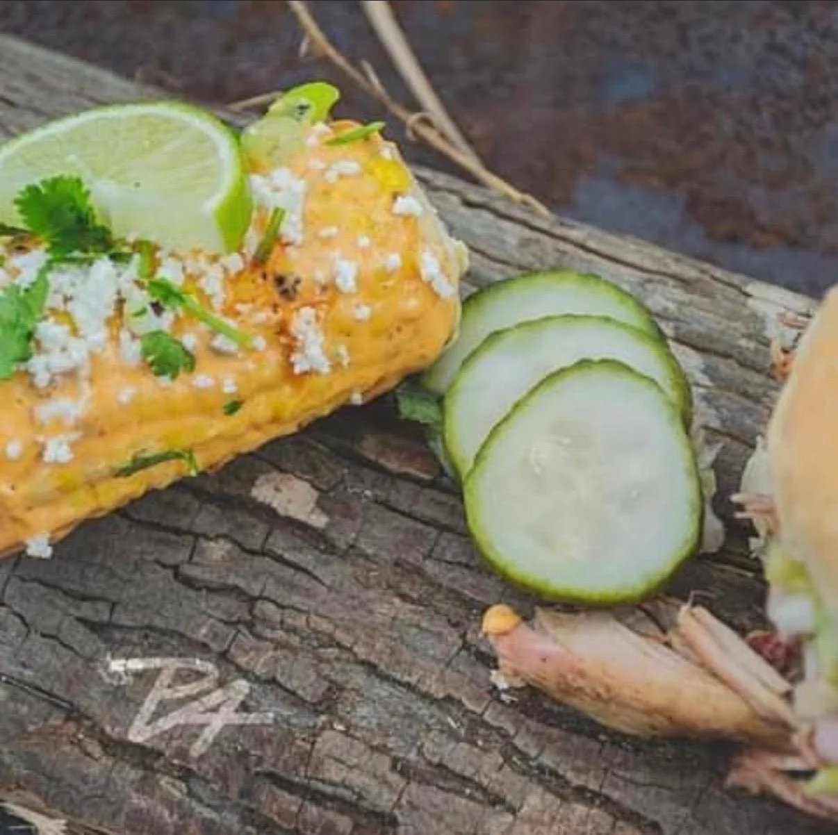 Mexican elote topped with cheese and lime