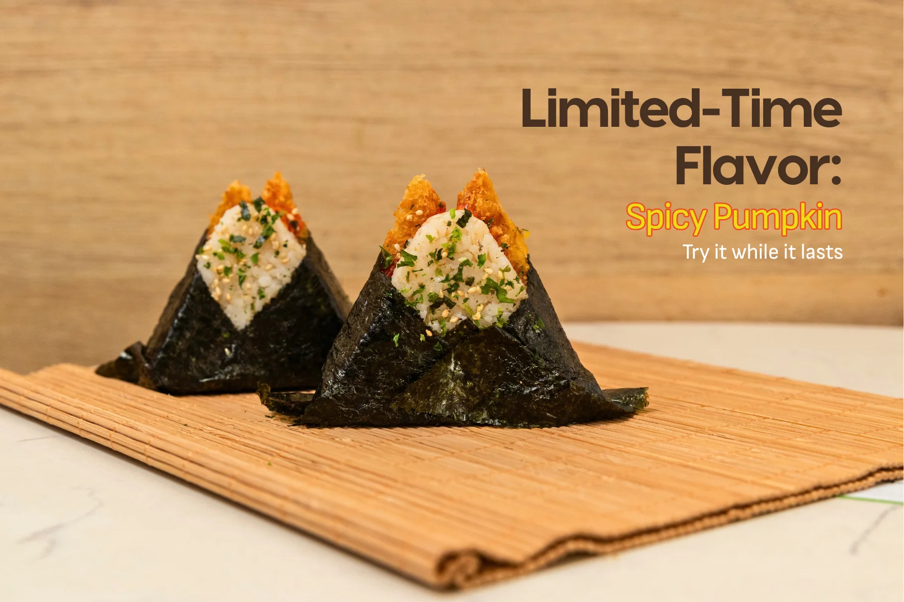 Japanese onigiri rice triangles wrapped in nori with spicy pumpkin filling