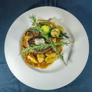 Savory French coq au vin with seasonal vegetables