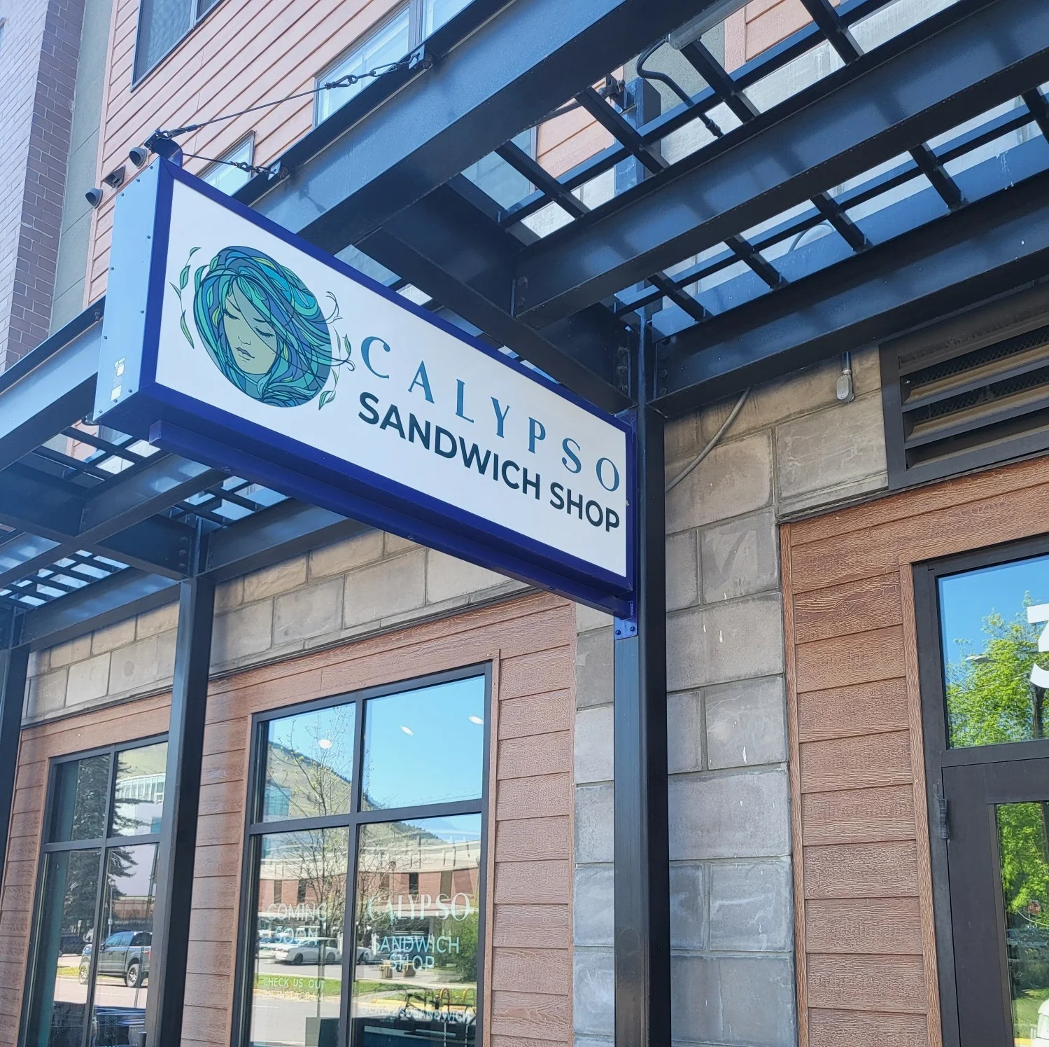 Exterior view of Calypso Sandwich Shop with outdoor seating