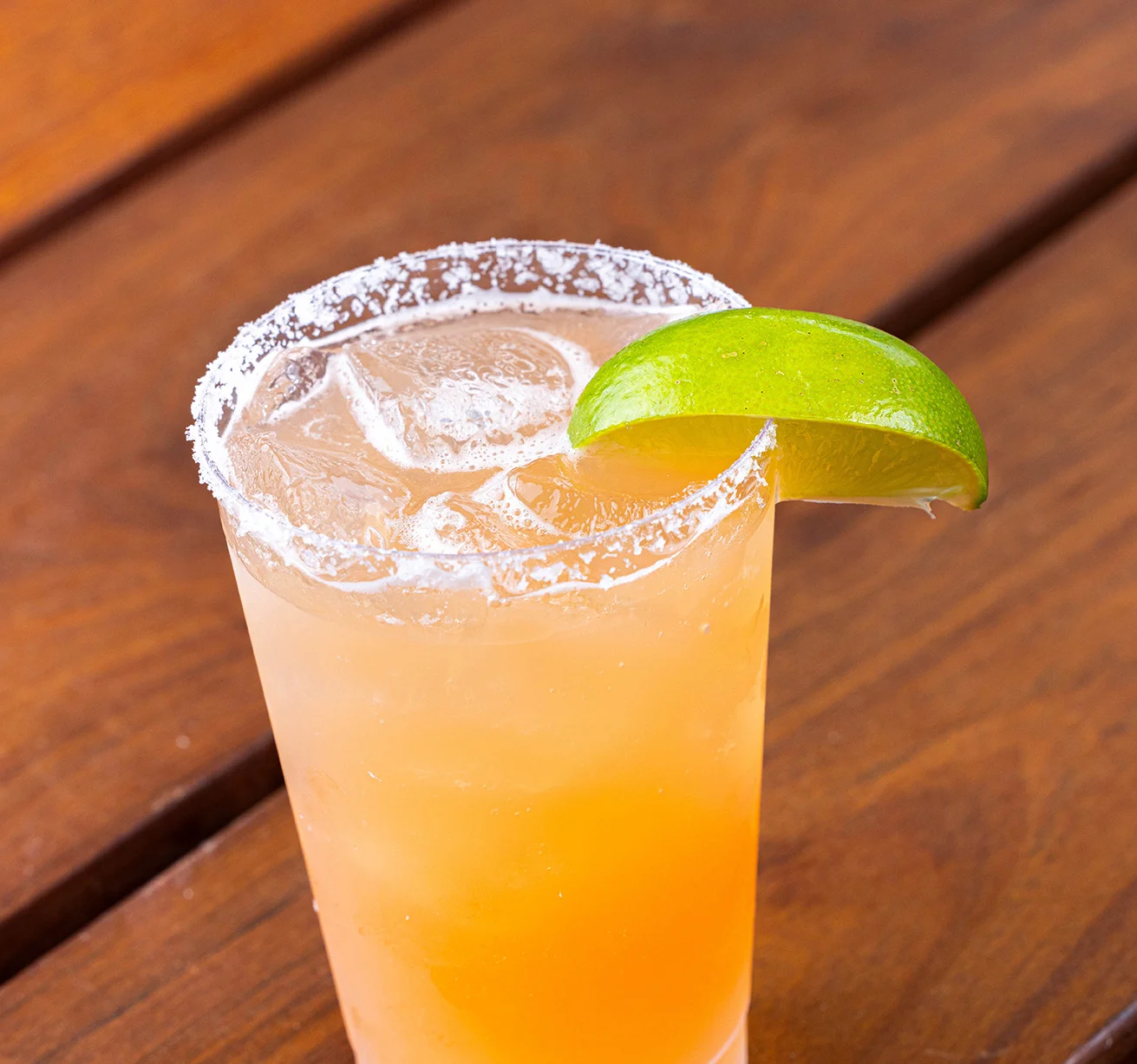 Cali Pali drink with a salted rim and a lime wedge