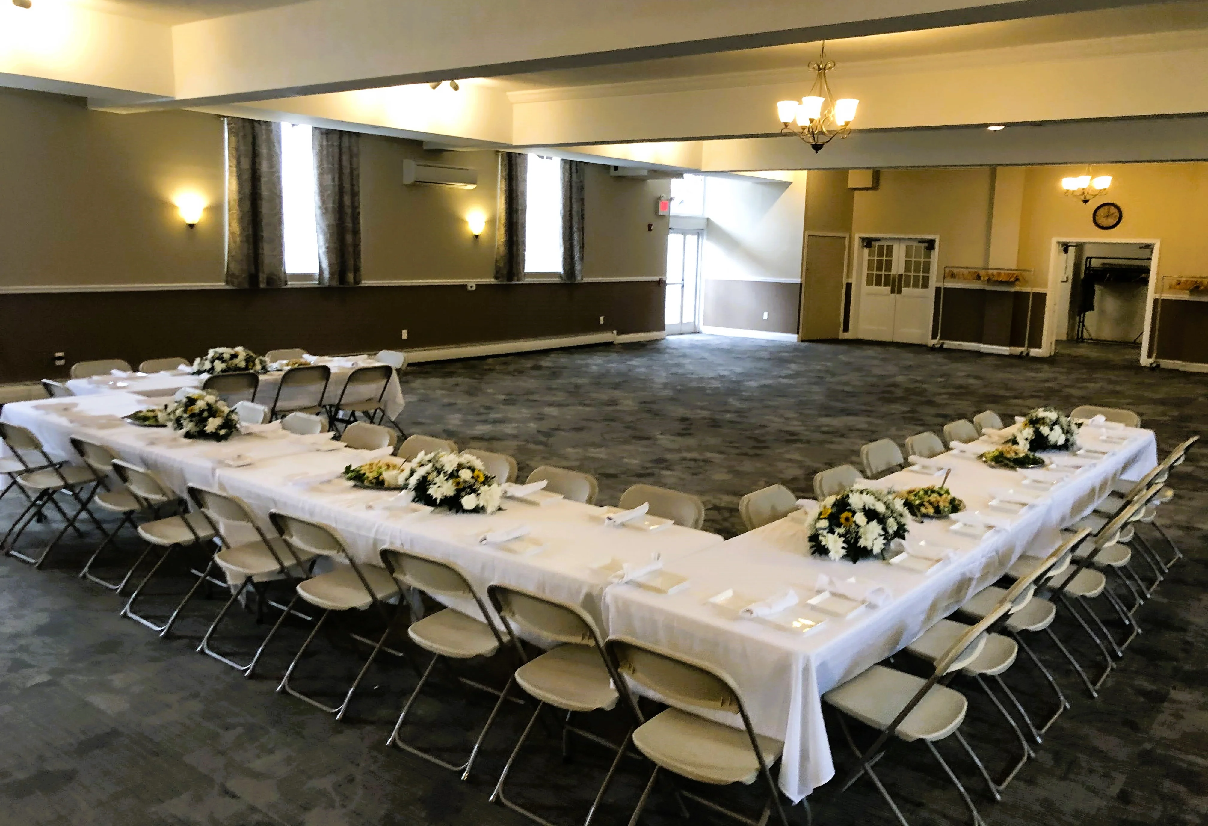 Elegant dining setup for a special event with floral centerpieces