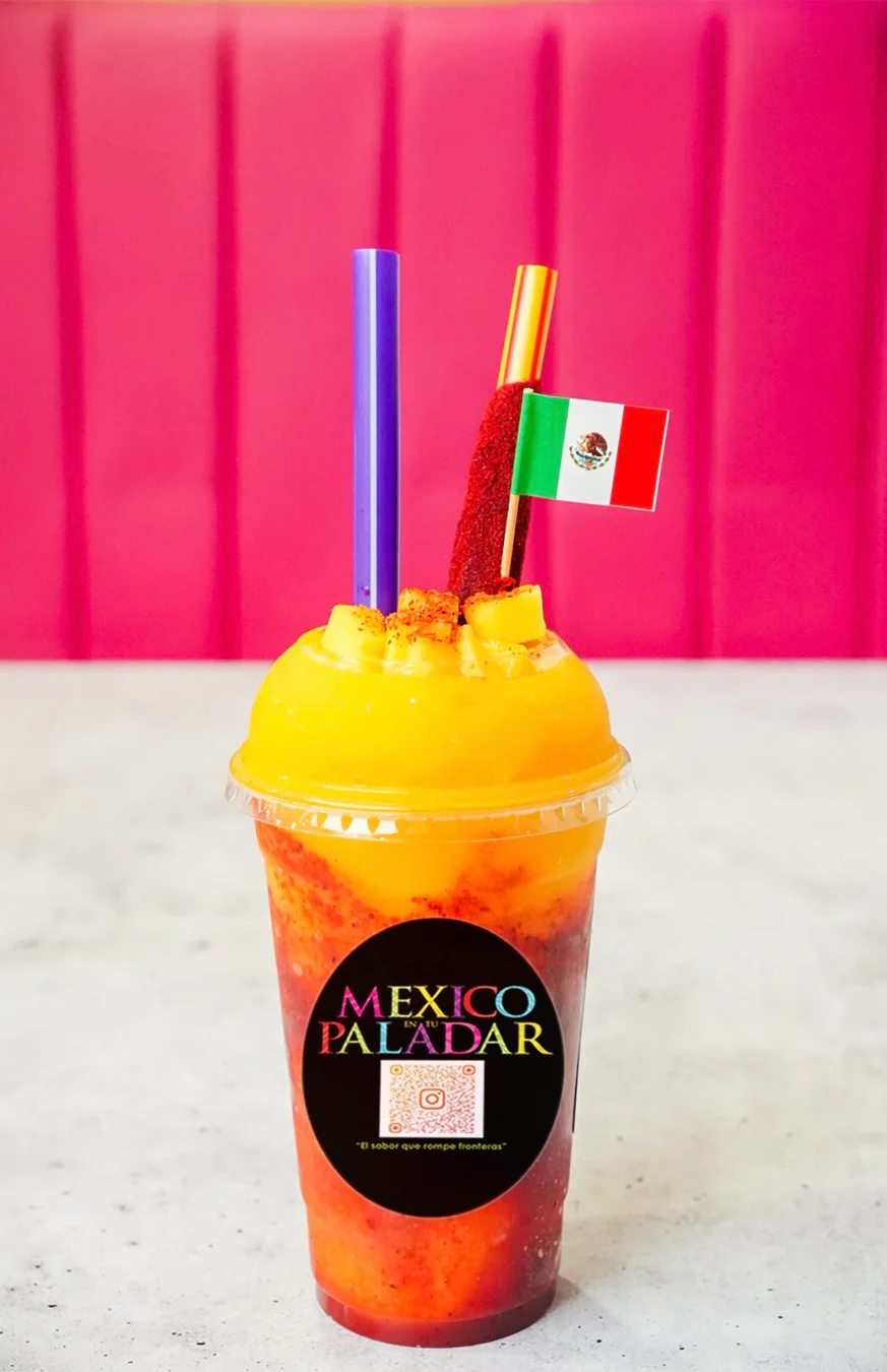 Colorful mango chamoy drink with Mexican flag