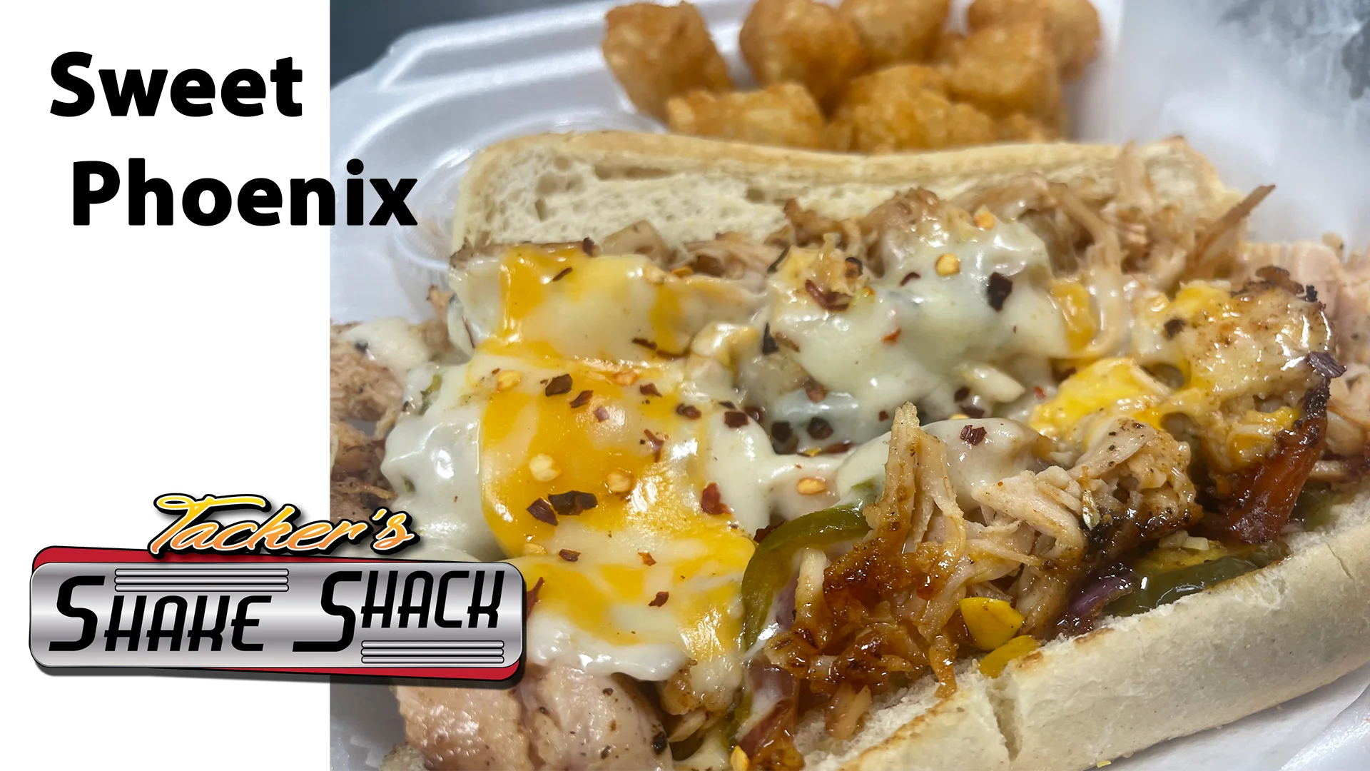 Pulled chicken sandwich with cheese and toppings