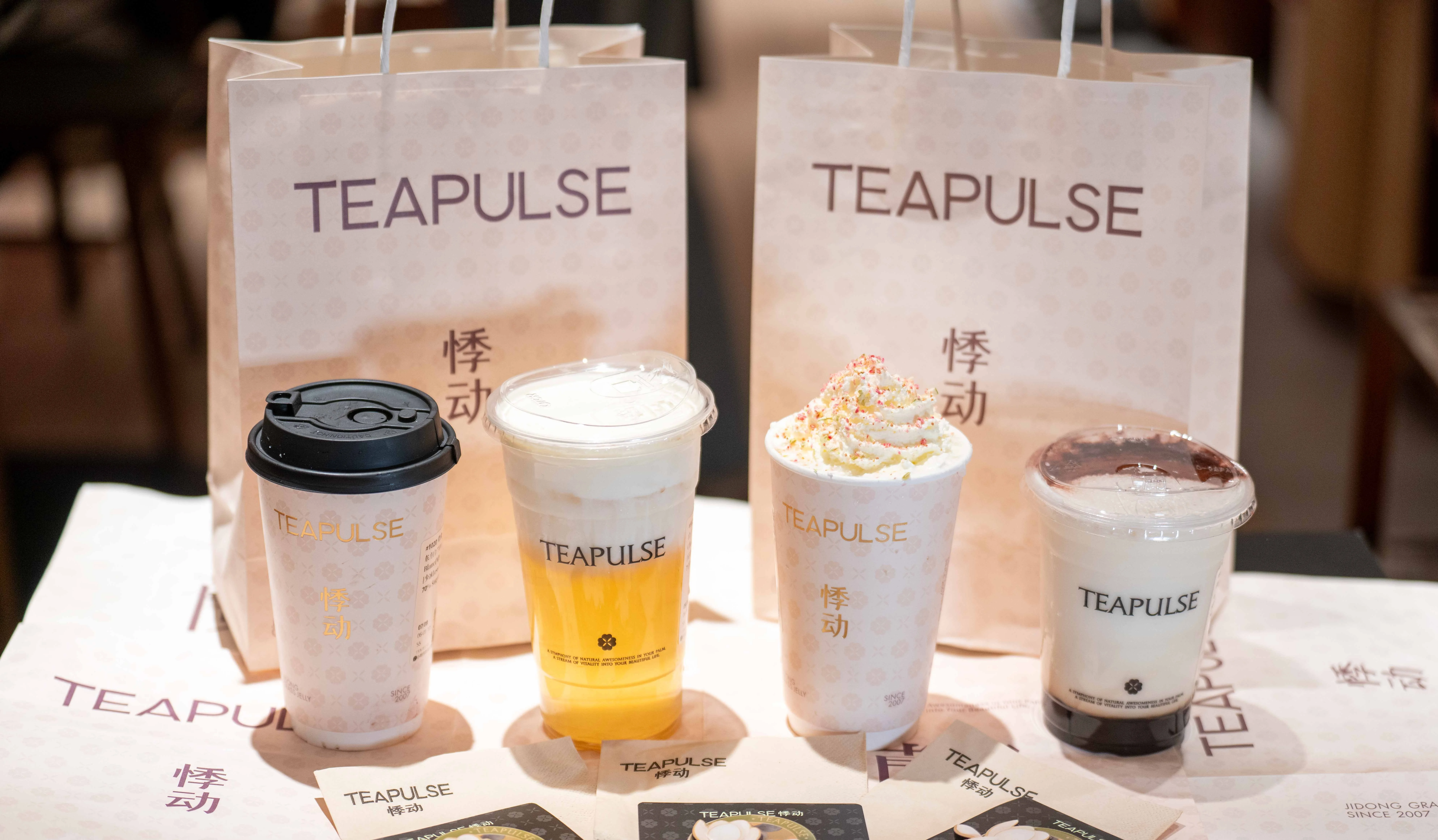 Assorted bubble tea drinks from Teapulse with decorative packaging