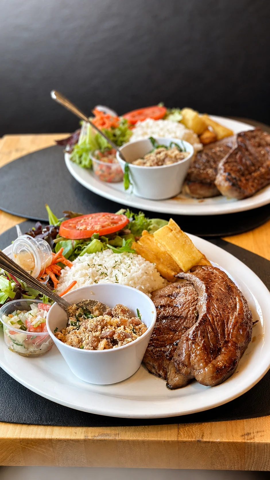 Grilled steak platter with rice and fresh salad