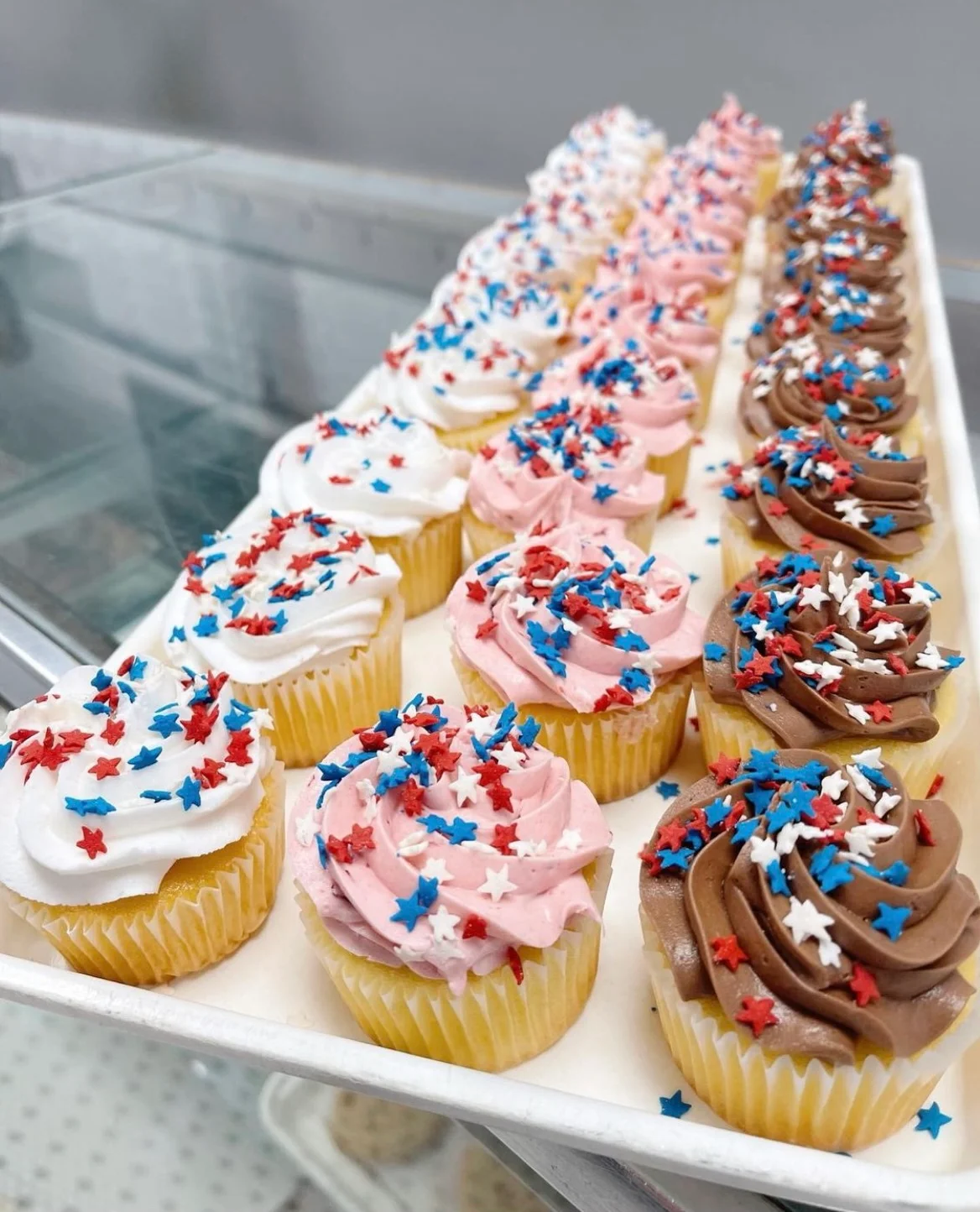 Festive cupcakes with red, white, and blue frosting for celebrations