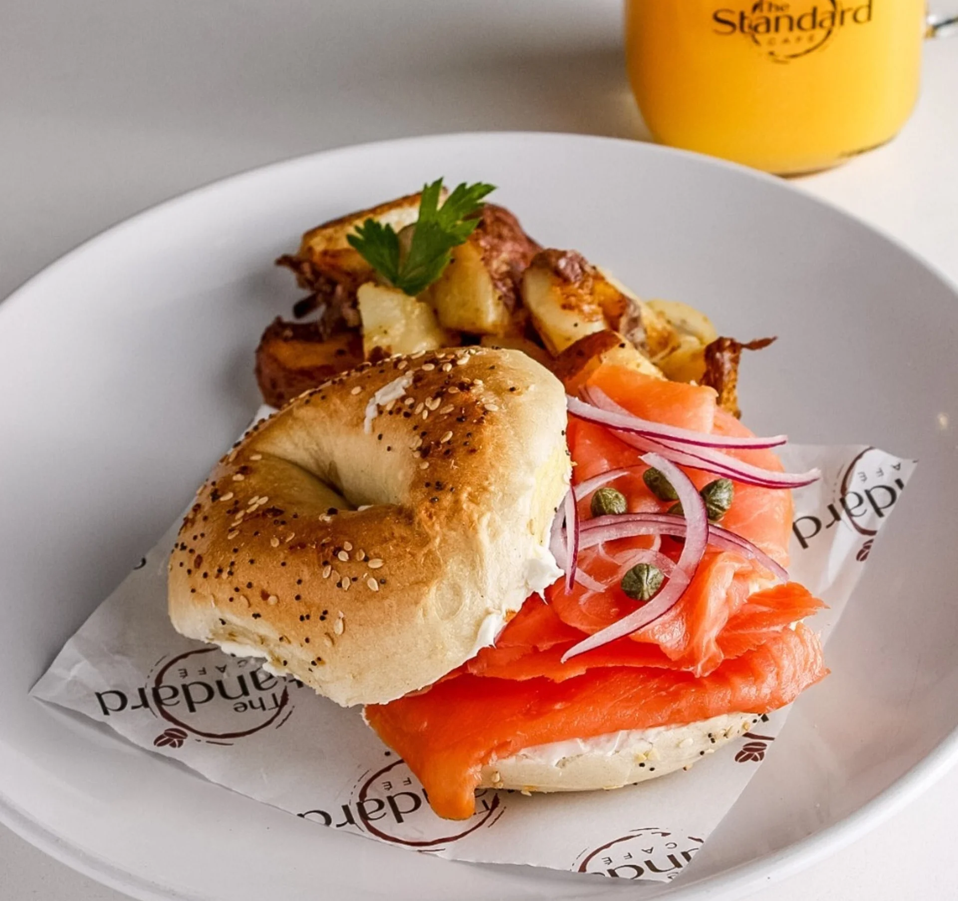 A breakfast bagel with potatoes