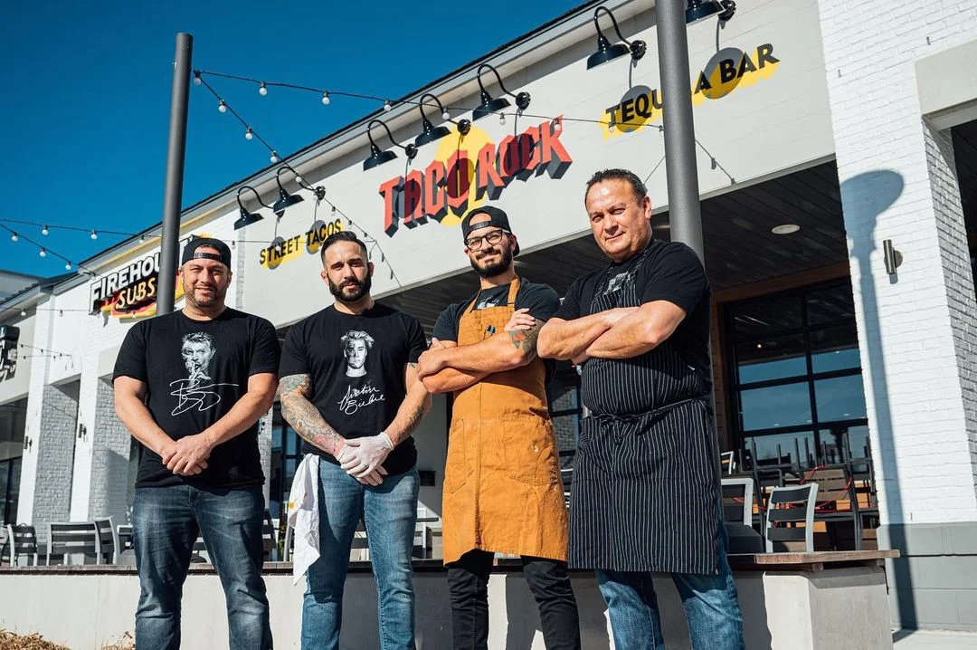 Chefs posing outside Taco Rock restaurant