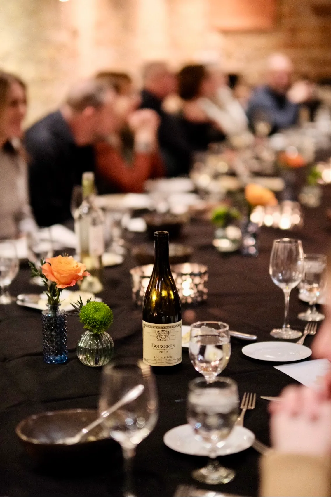 Elegant dining setup with wine and floral decor
