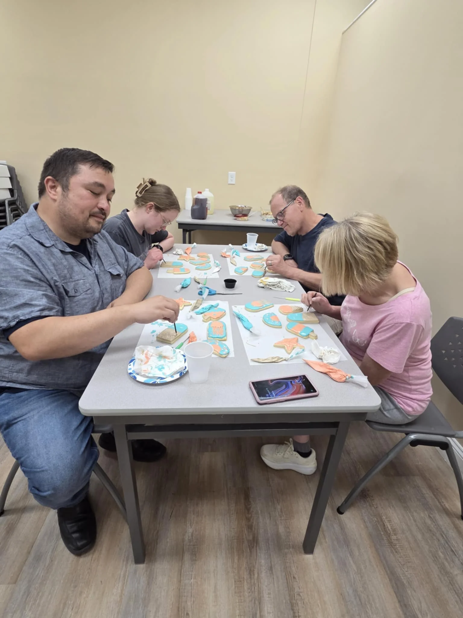 Group decorating cookies in a creative workshop