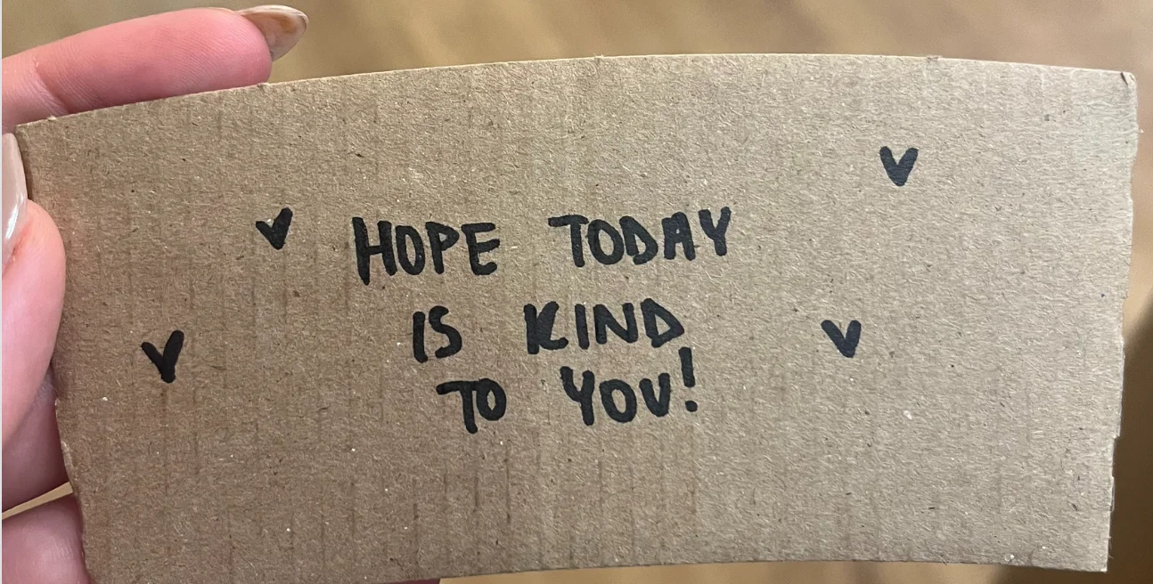 Handwritten note wishing kindness for the day