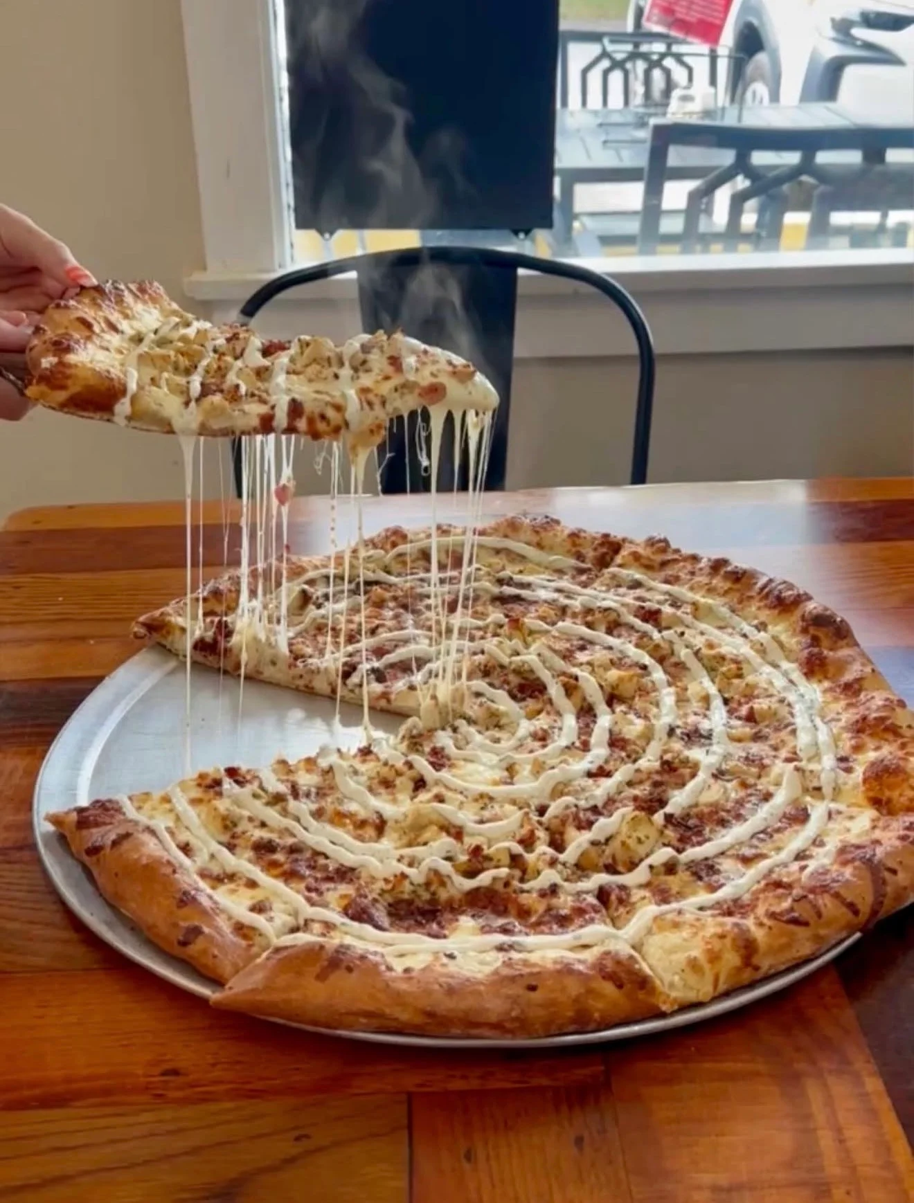 Cheesy chicken alfredo pizza with a golden crust
