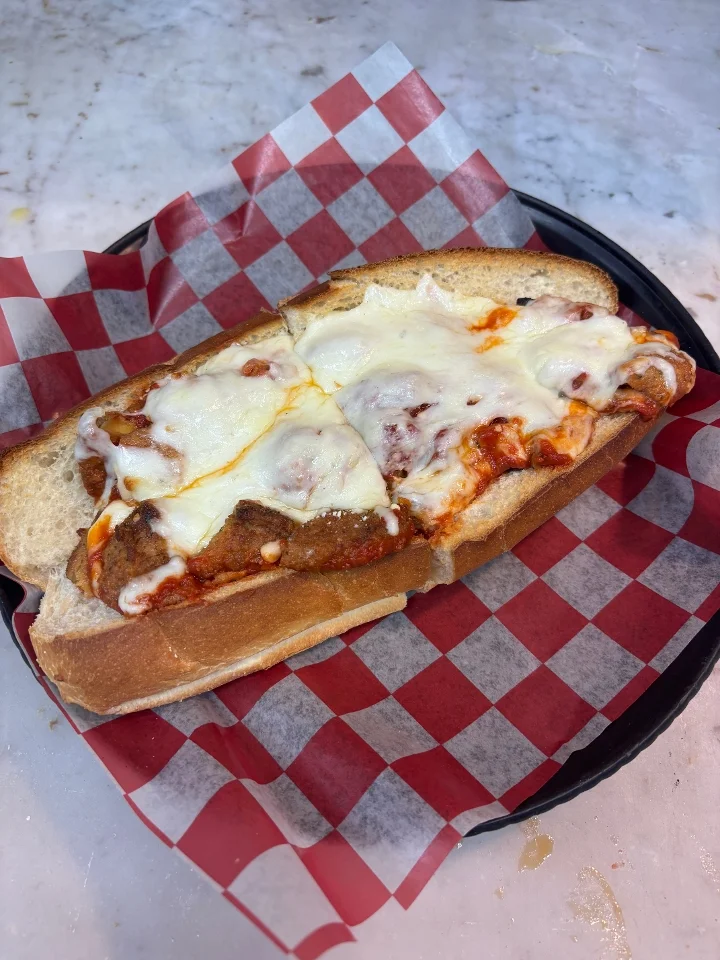 Pasquale’s hot Parmesan sub with tomato sauce and melted cheese