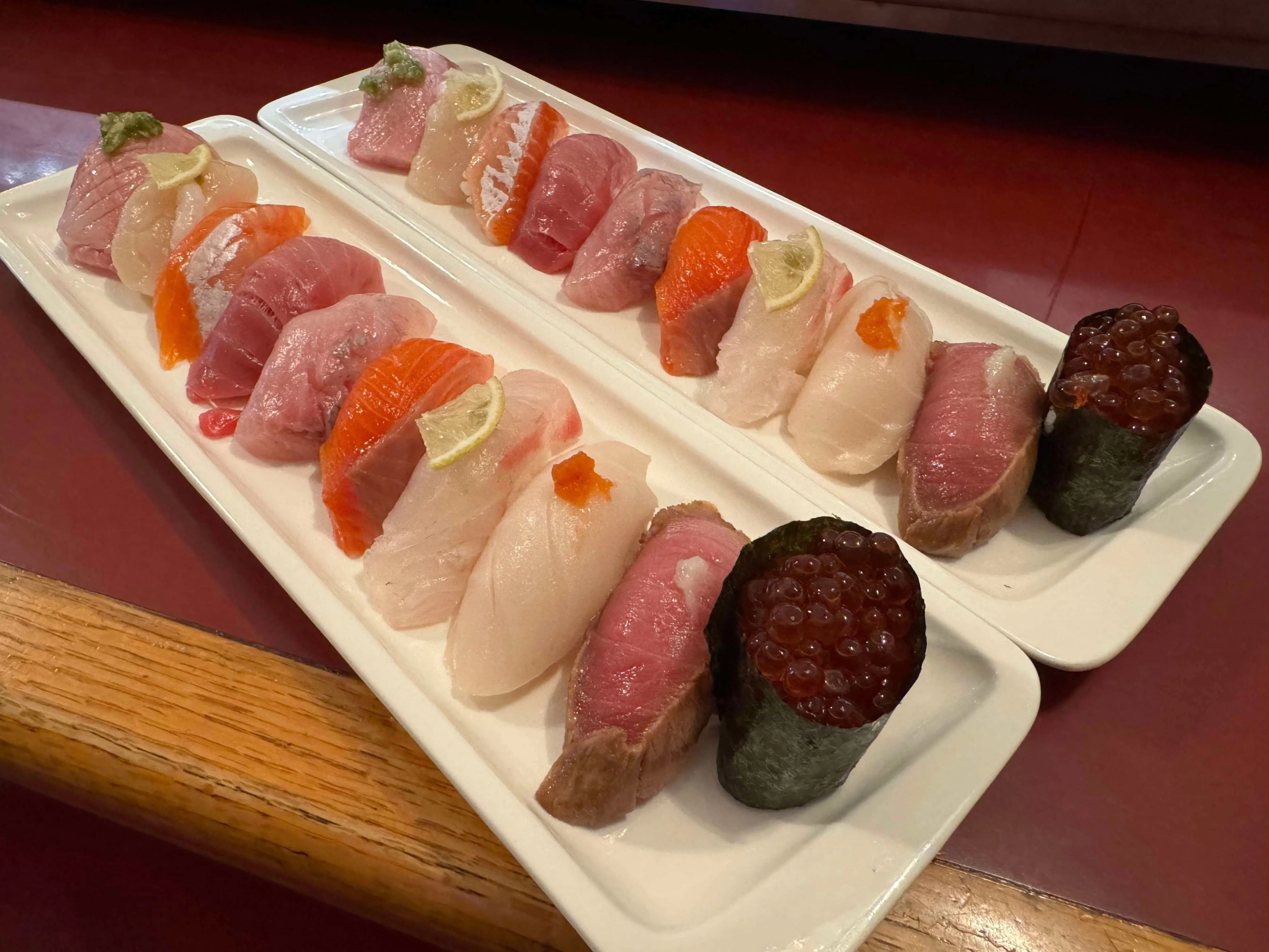 Assorted sushi platter featuring fresh nigiri and gunkan-style sushi