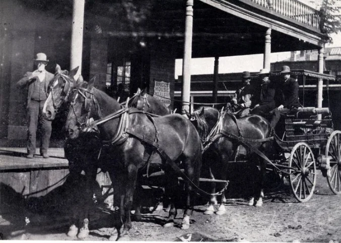 Historic black-and-white photograph of the St. Charles Hotel in downtown Carson City, Nevada, built in 1862 as a major stage stop and landmark building, now home to The Fox Restaurant & Brewery