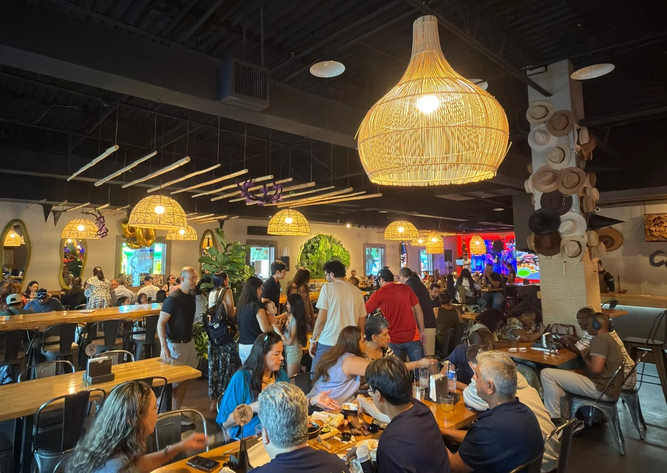 Lively restaurant interior with warm lighting and bustling diners