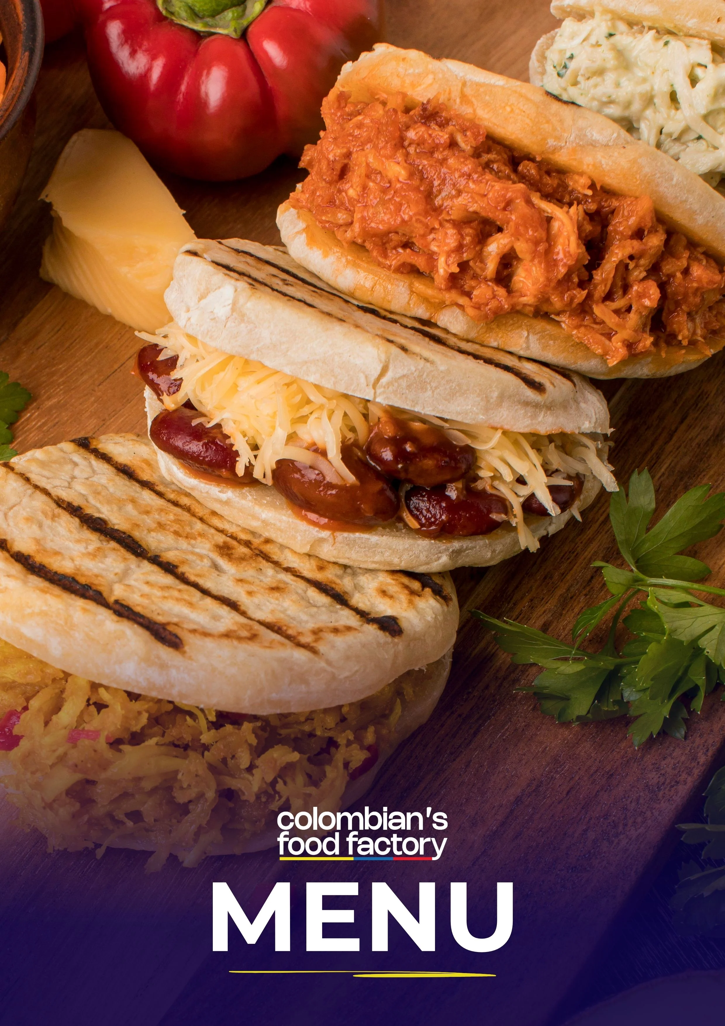 Colombian arepas with various fillings on a wooden board