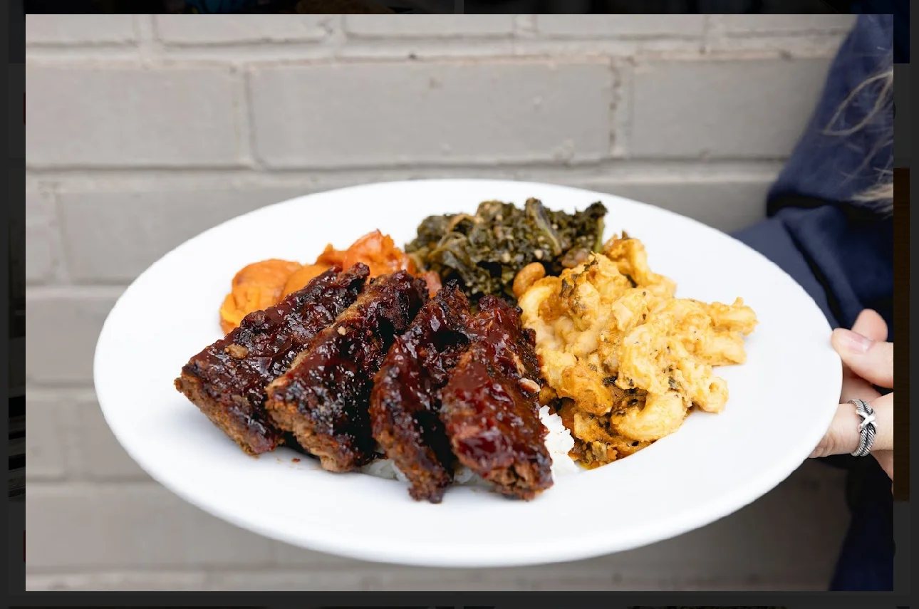 Southern-style meatloaf with sides of collard greens and macaroni and cheese