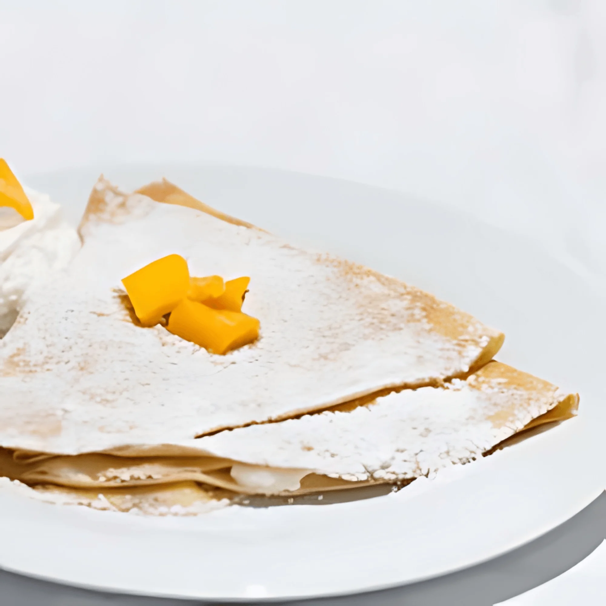 Delicious Thai mango crepes with whipped cream