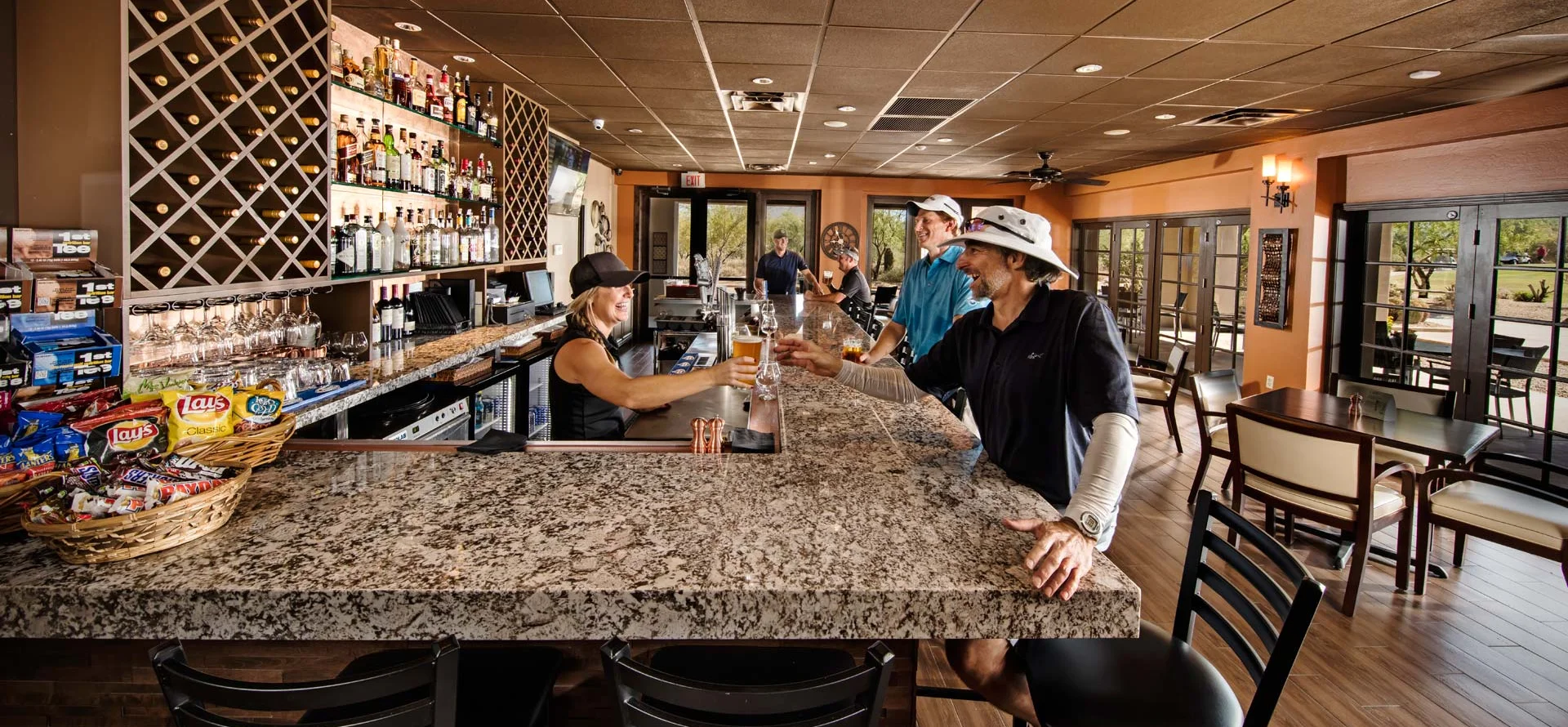 Modern bar interior with patrons enjoying drinks