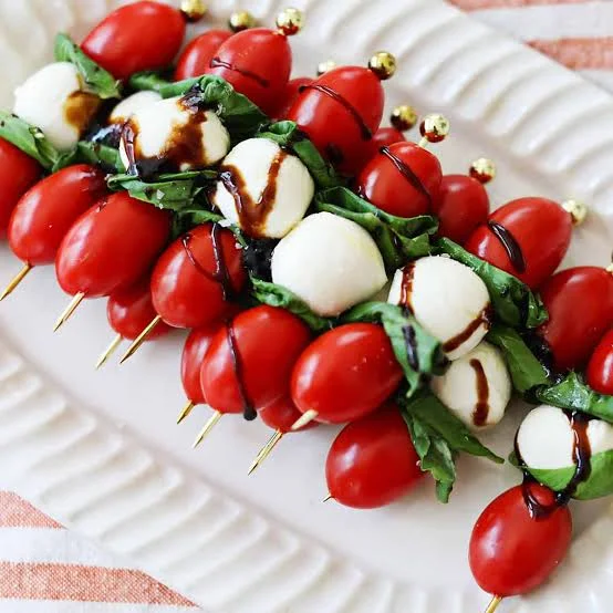 Caprese skewers with cherry tomatoes and mozzarella