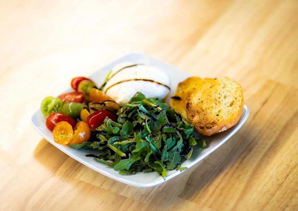Caprese salad with fresh mozzarella and heirloom tomatoes