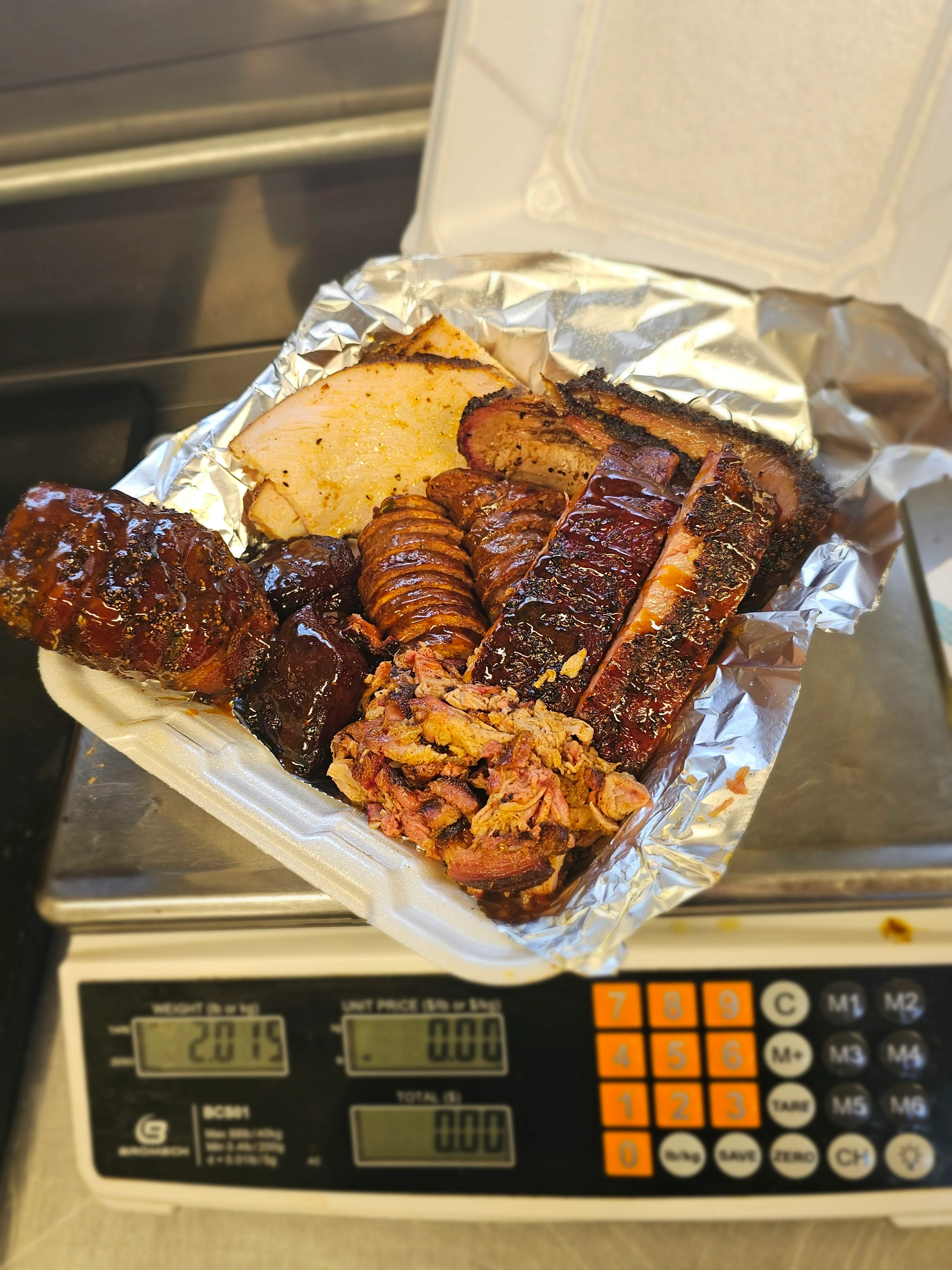 Assorted barbecue platter featuring smoked meats