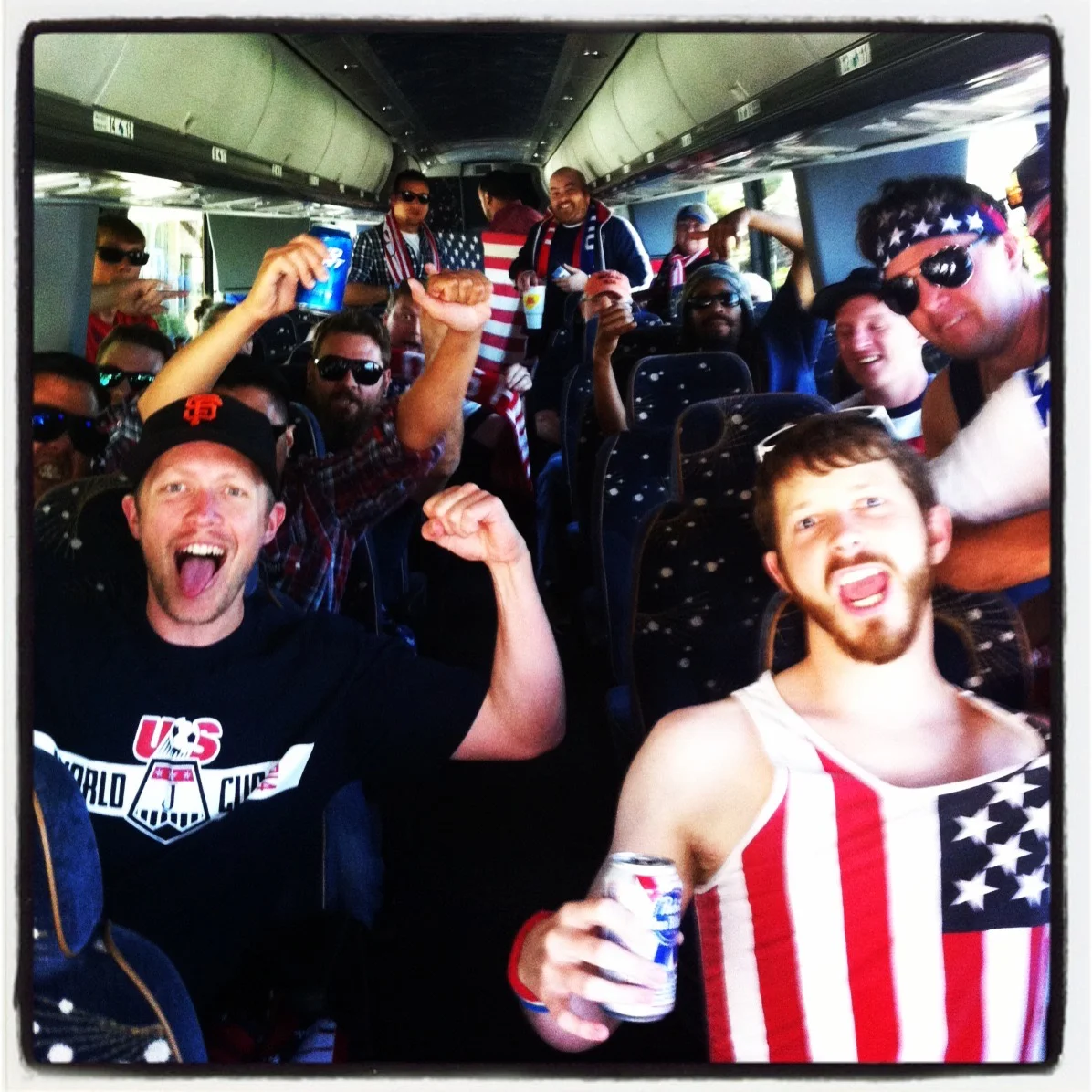 Cheering fans on a bus celebrating a sports event