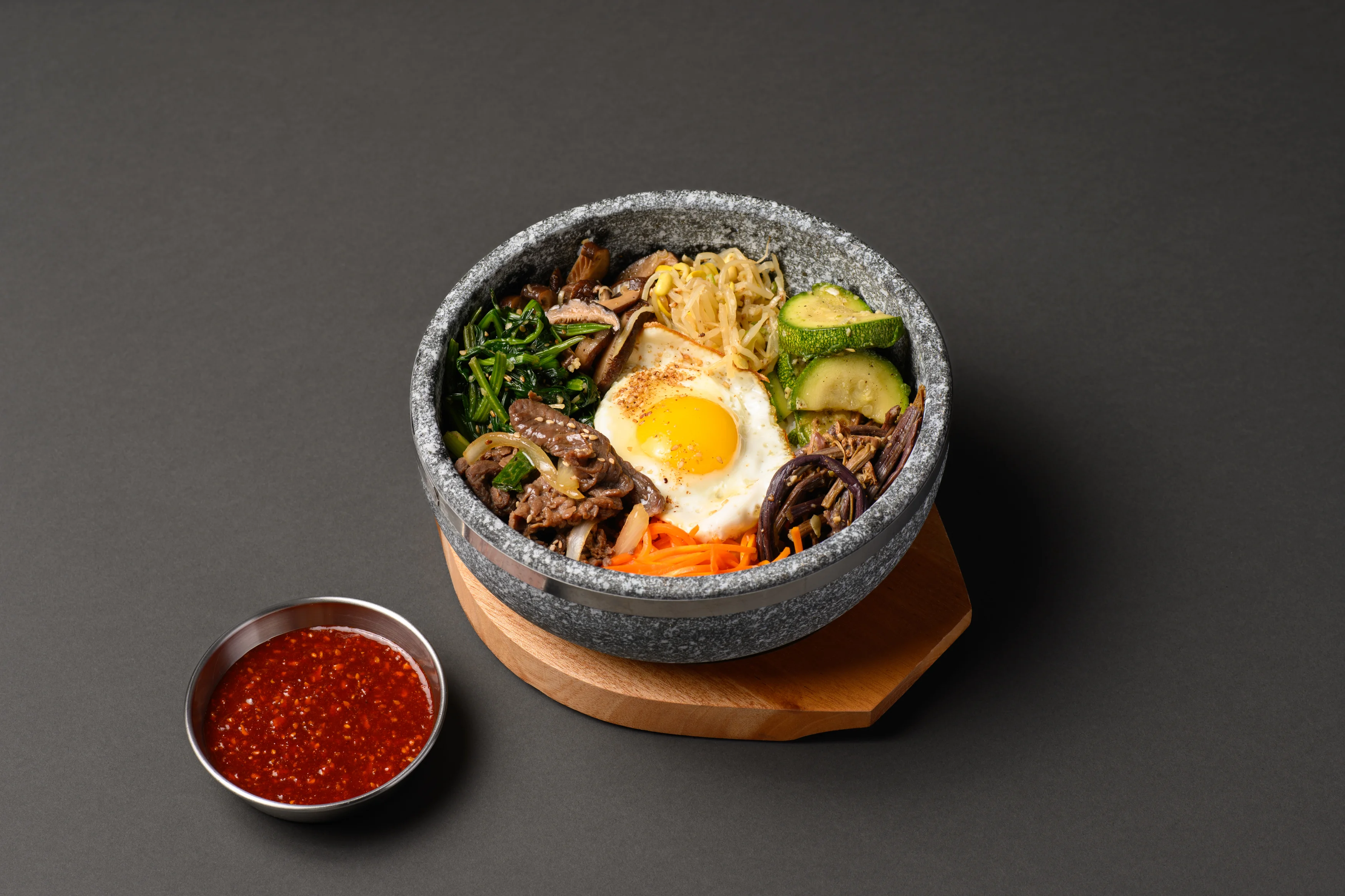 Korean bibimbap served in a hot stone bowl