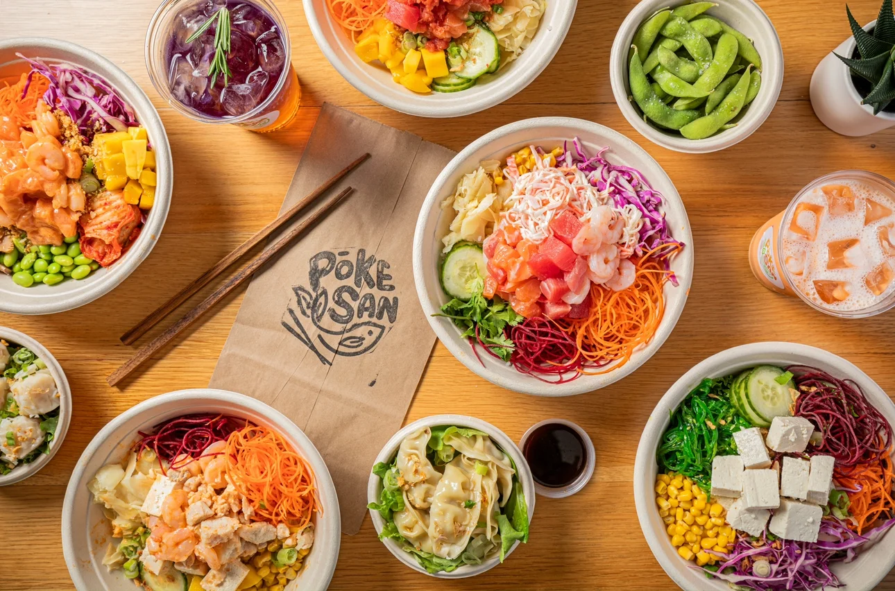 Colorful poke bowls with fresh seafood and vegetables
